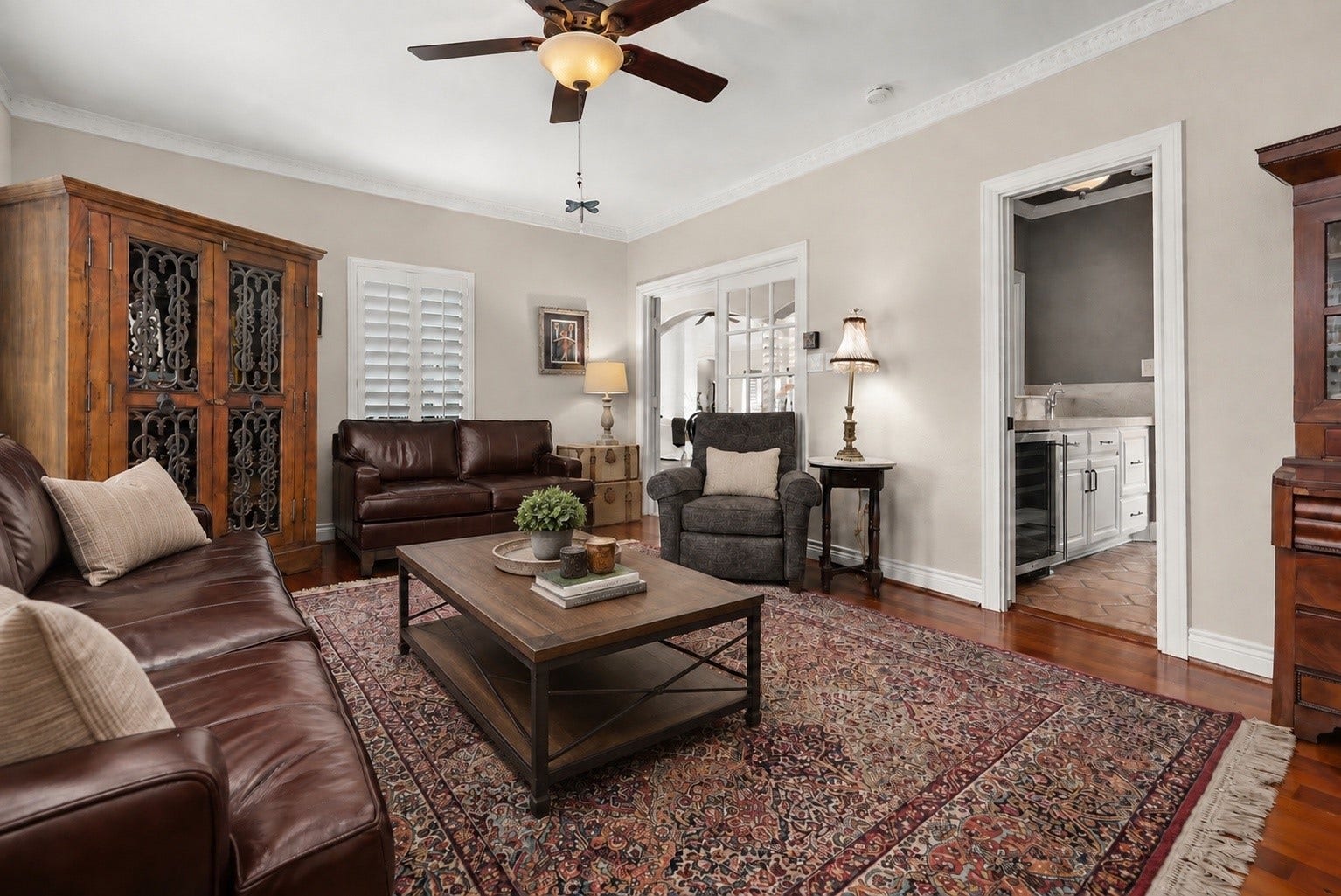 18607 Point Lookout Drive, Nassau Bay, TX 77058 Currently used as a cozy television room, this versatile space features beautiful solid mesquite wood flooring brought in from Austin, plantation shutters, and a convenient walk-through wet bar connecting to the kitchen. Located just off the entryway near the dining area.