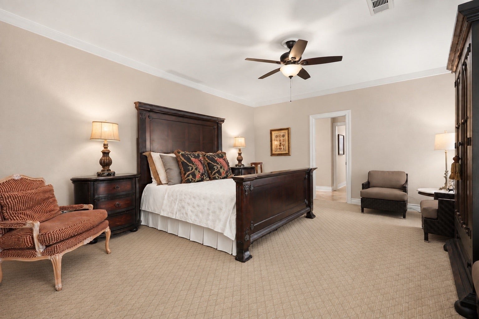 18607 Point Lookout Drive, Nassau Bay, TX 77058 Spacious primary suite offers a relaxing retreat with high ceilings, elegant crown molding, and plenty of room for a comfortable sitting area. Three windows overlooking the beautiful pool bring in natural light and lovely views, creating a warm and inviting private sanctuary.