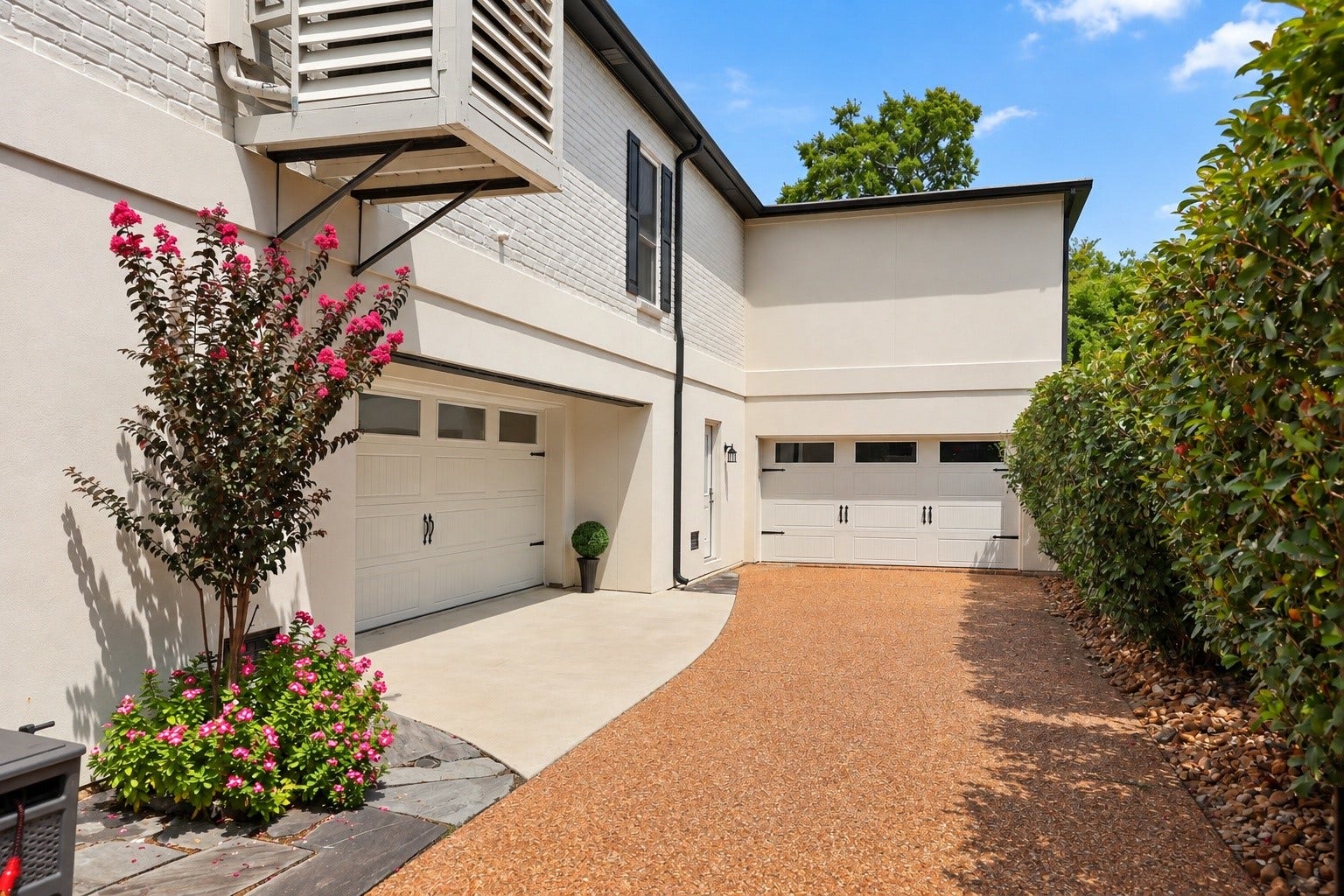 18607 Point Lookout Drive, Nassau Bay, TX 77058 Expansive driveway leads to abundant covered parking and storage beneath the elevated home. Garage access is located to the left, with additional open parking straight ahead. The area beneath the pool house provides exceptional storage space, allowing the main covered area beneath the home to remain open, spacious, and versatile.