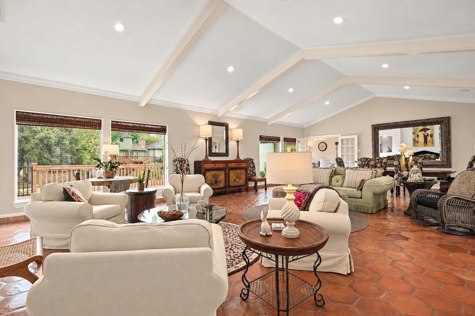 18607 Point Lookout Drive, Nassau Bay, TX 77058 Expansive windows fill this beautiful living space with natural light, while soaring ceilings with decorative beams and a tastefully selected neutral paint palette create a warm, welcoming atmosphere.