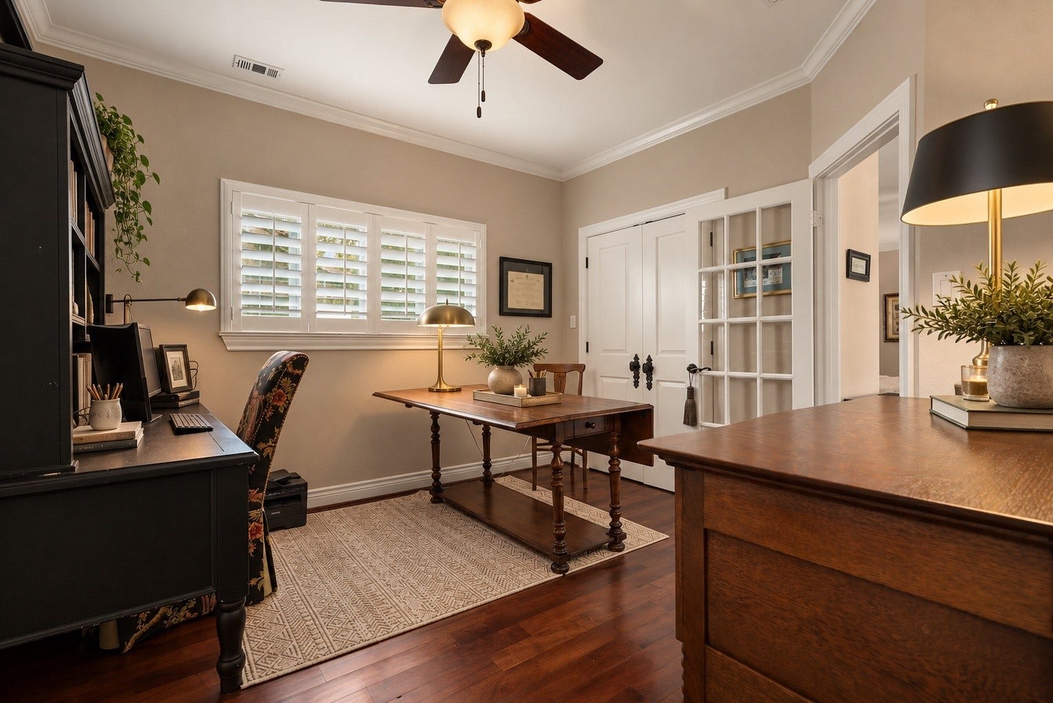 18607 Point Lookout Drive, Nassau Bay, TX 77058 Bedroom #3, currently used as a home office, offers wonderful versatility with beautiful solid mesquite hardwood flooring sourced from Austin, plantation shutters, and elegant French doors. This spacious room shares a beautifully appointed bathroom with Bedroom #2 and can easily serve as a guest bedroom or private study.