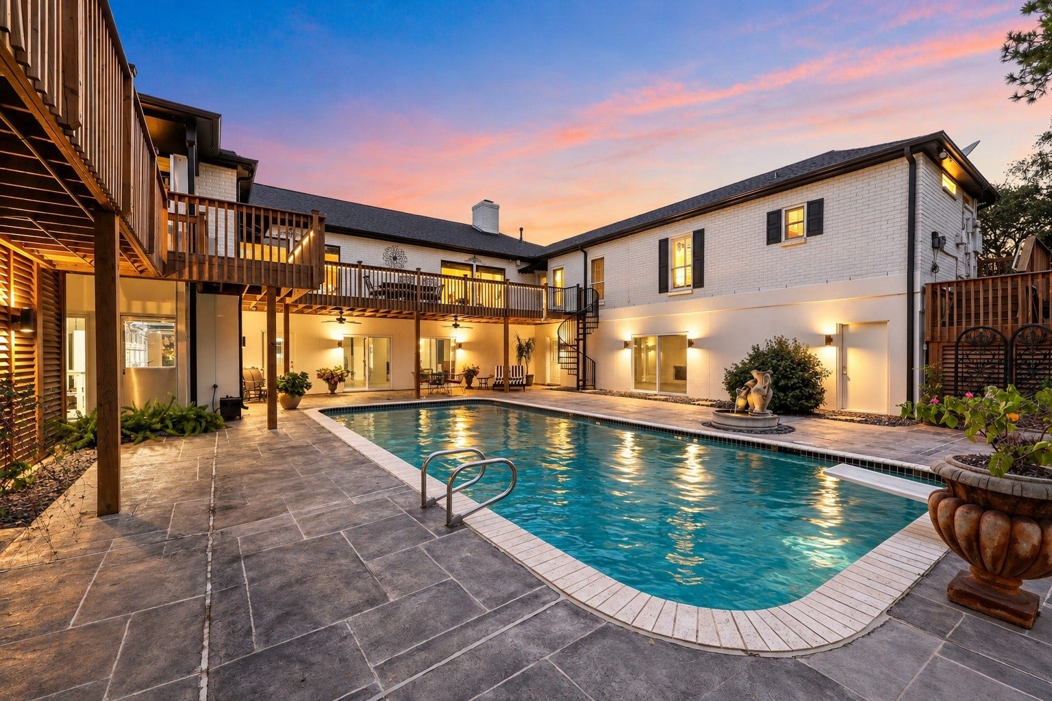 18607 Point Lookout Drive, Nassau Bay, TX 77058 Beautiful accent lighting illuminates the pool and courtyard, highlighting the custom architectural louvers with dramatic up-and-down lighting, while decorative louvered screening cleverly conceals the pool equipment.