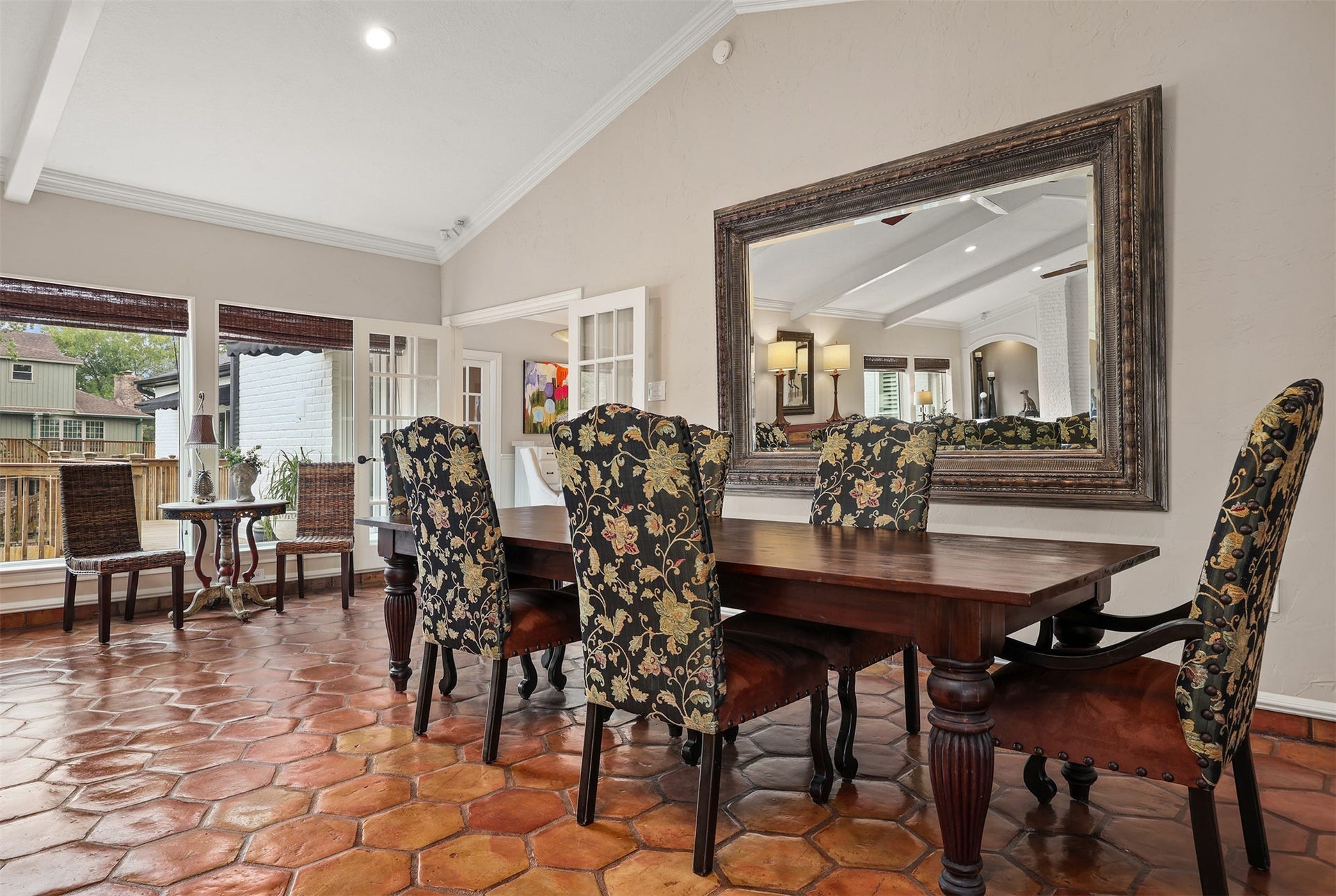 18607 Point Lookout Drive, Nassau Bay, TX 77058 This spacious dining area is perfect for entertaining, featuring beautiful natural light and an impressive oversized decorative mirror that conveys with the home. Double French doors open to the breakfast room and kitchen, offering the flexibility of an open, inviting flow or added privacy while preparing meals and entertaining guests.