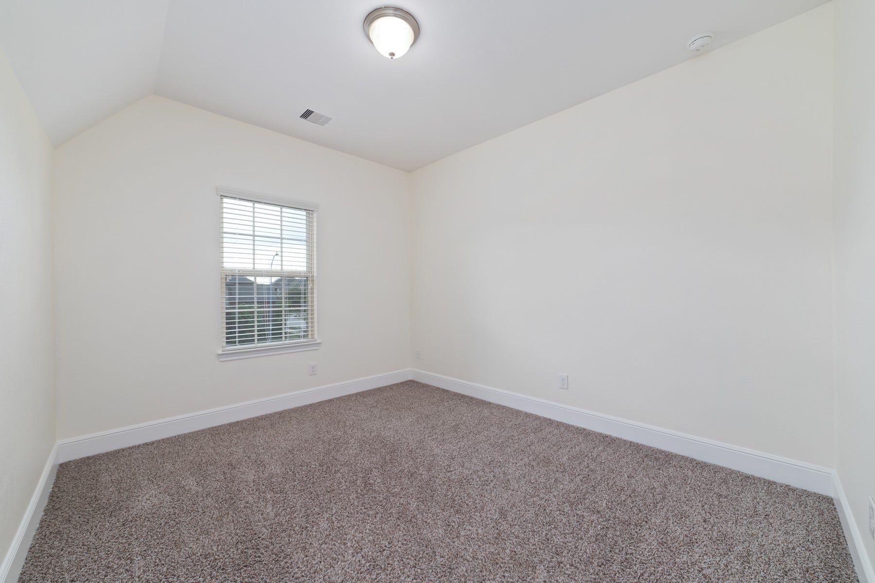 11103 Dowbeck Avenue, Richmond, TX 77407 Bedroom #4 - This room features neutral walls, a plush carpet, and a single window with a decorative shade, providing a cozy and versatile space.
