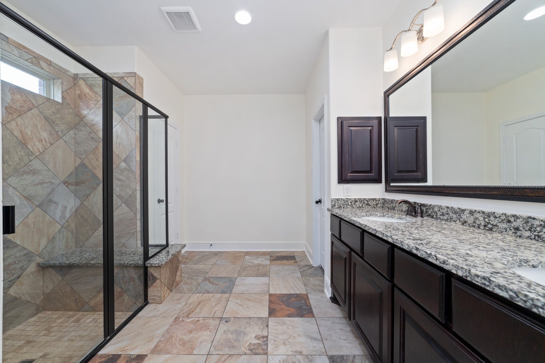 11103 Dowbeck Avenue, Richmond, TX 77407 This secondary bathroom ensure is in the secondary in law suite.