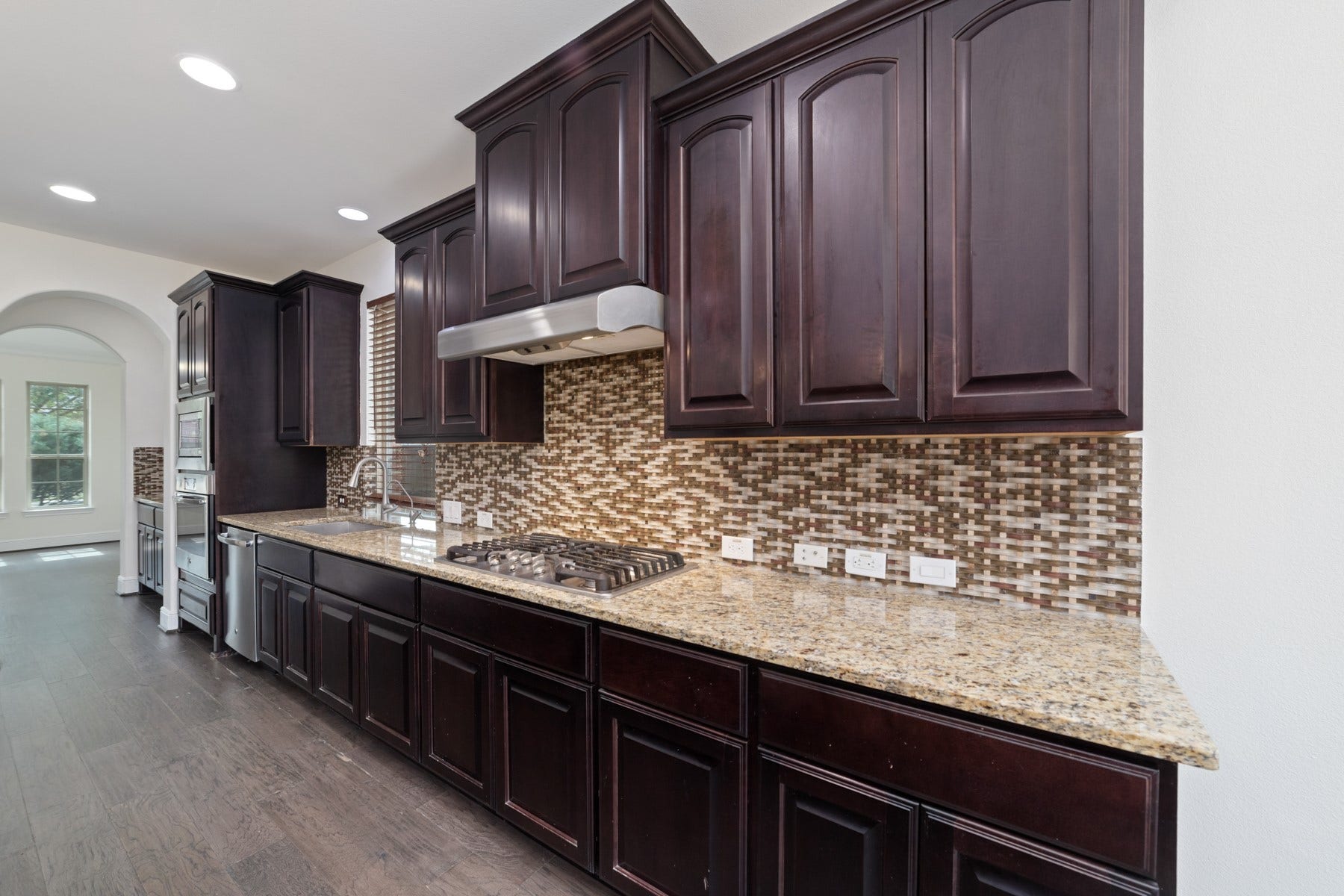11103 Dowbeck Avenue, Richmond, TX 77407 The kitchen has plenty of storage space and open to the living room.