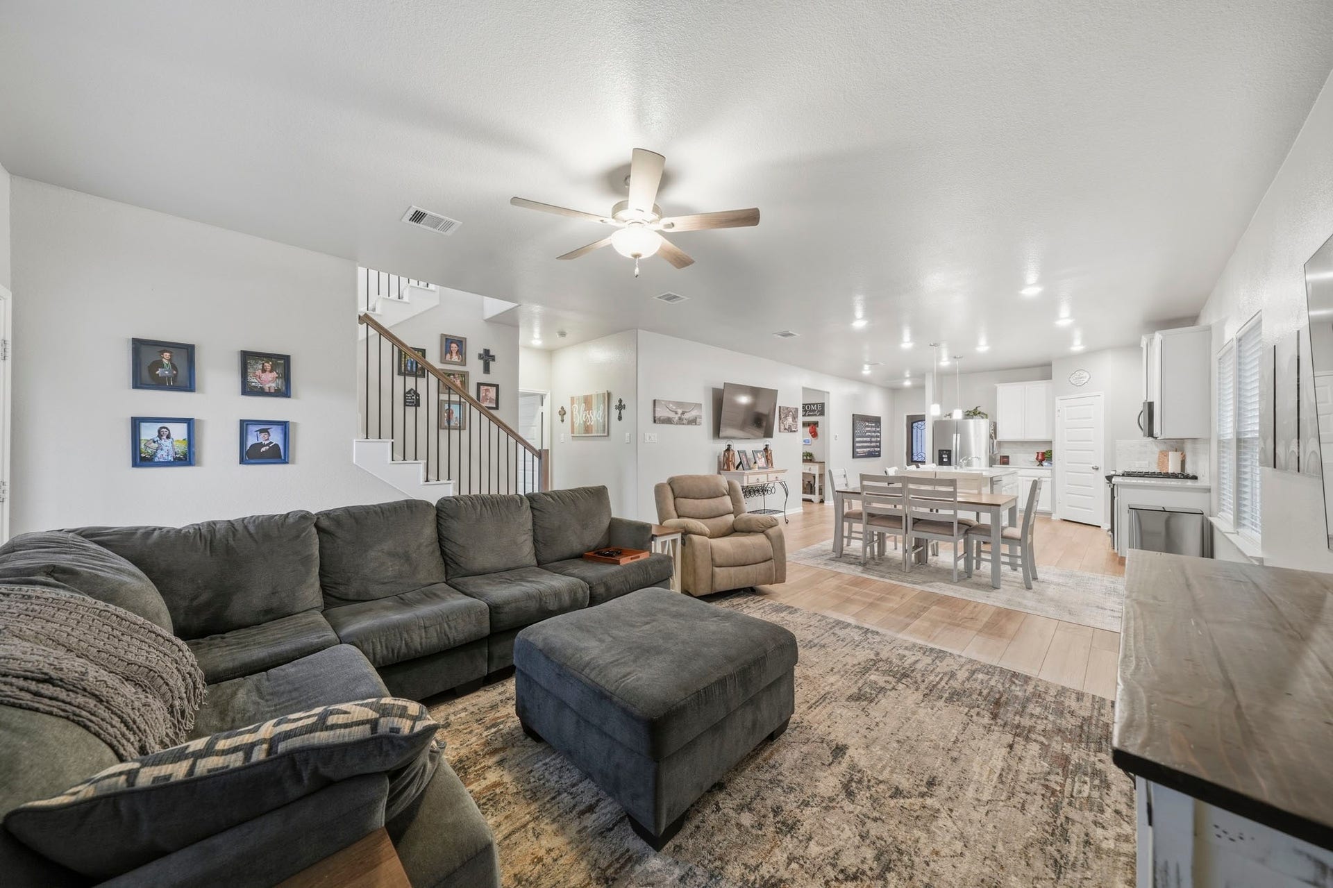 Open-concept living area to the modern dining space and a sleek kitchen, perfect for entertaining and family gatherings.