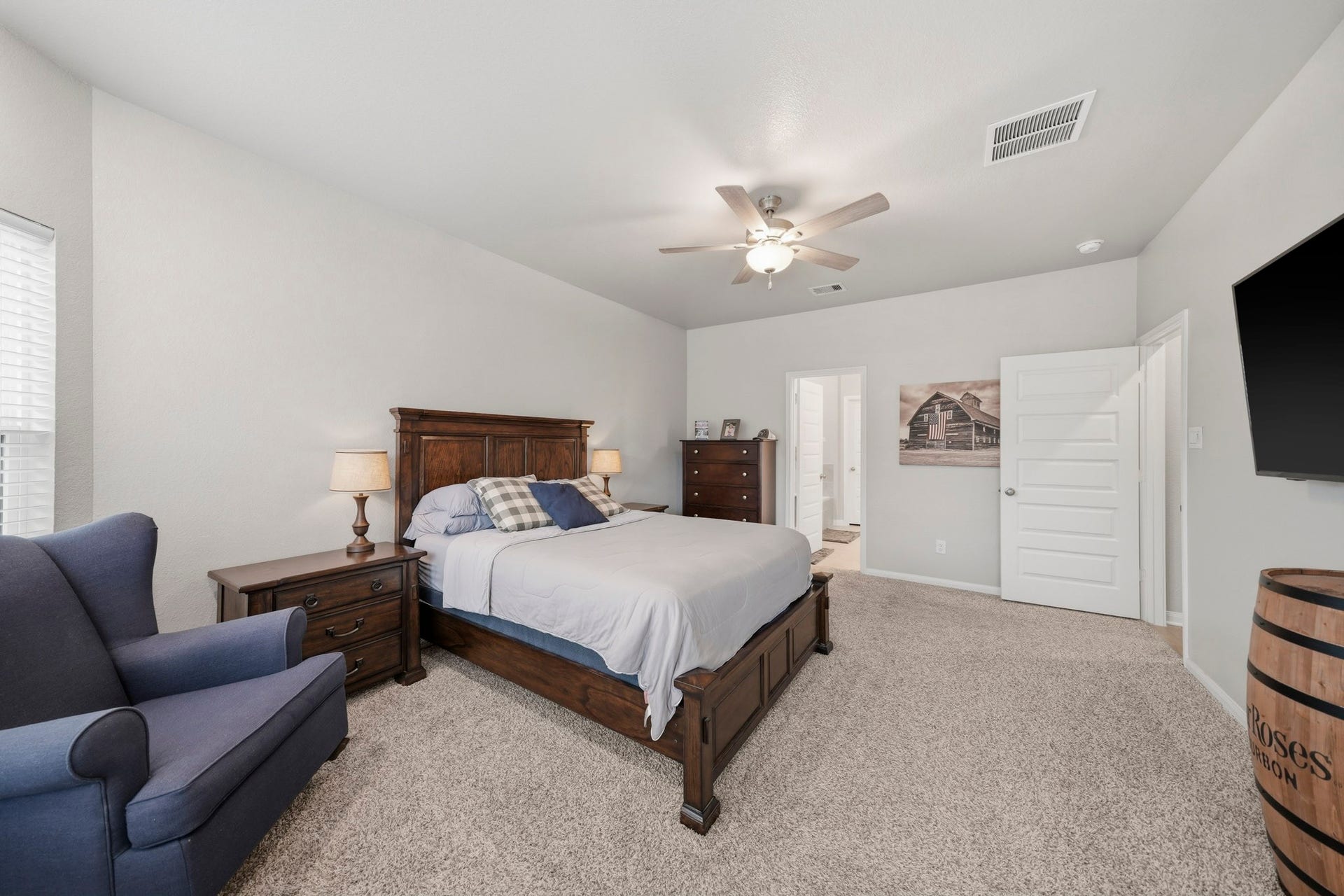 Spacious bedroom with carpet flooring,