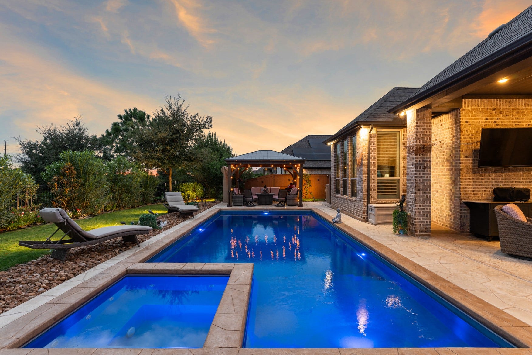 2214 Almond Creek Lane, Fulshear, TX 77423 The pool is heated so it can be enjoyed year-round. Relax in the connected spa!
