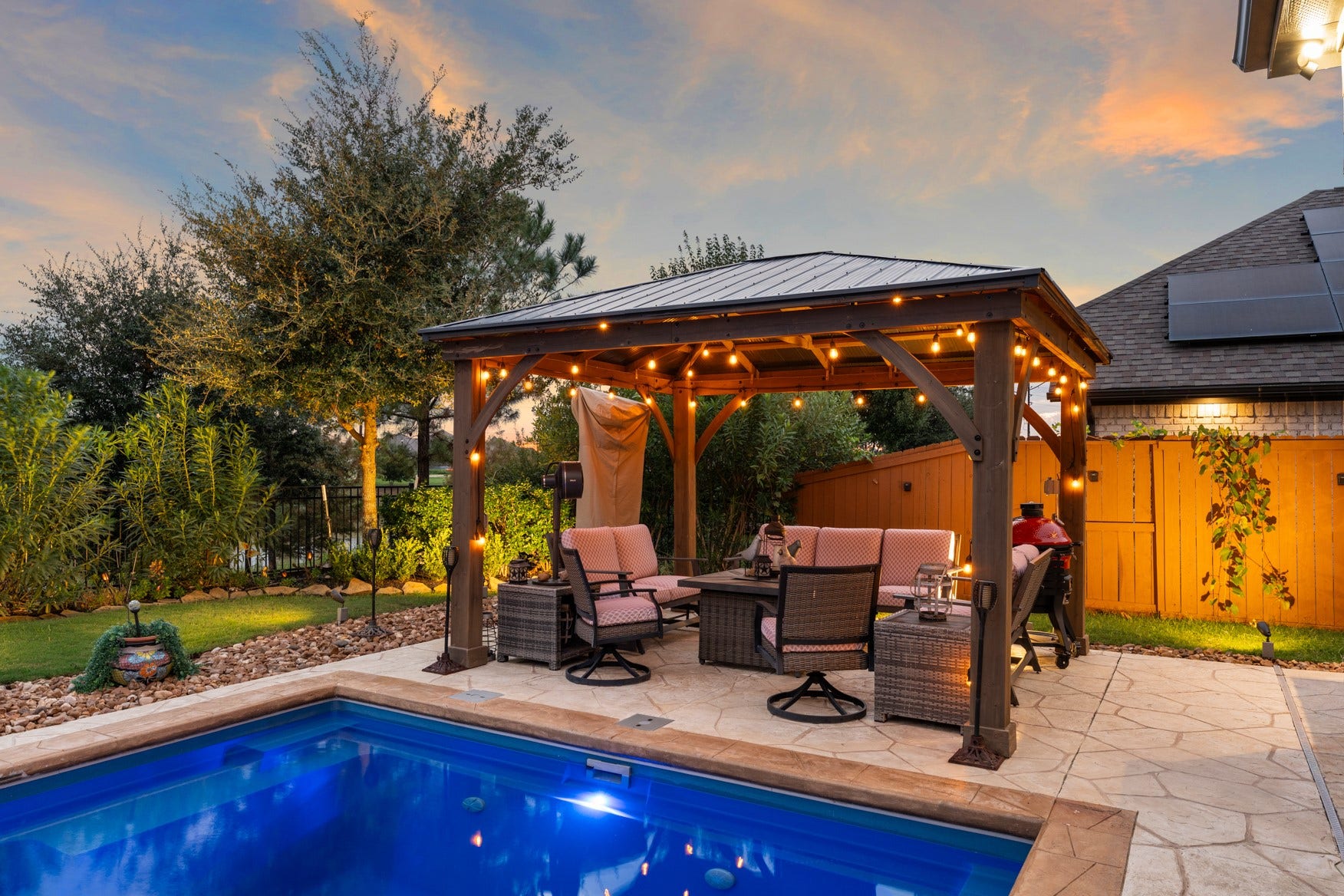 2214 Almond Creek Lane, Fulshear, TX 77423 A second covered patio is large enough for outdoor furniture and a fire pit table.