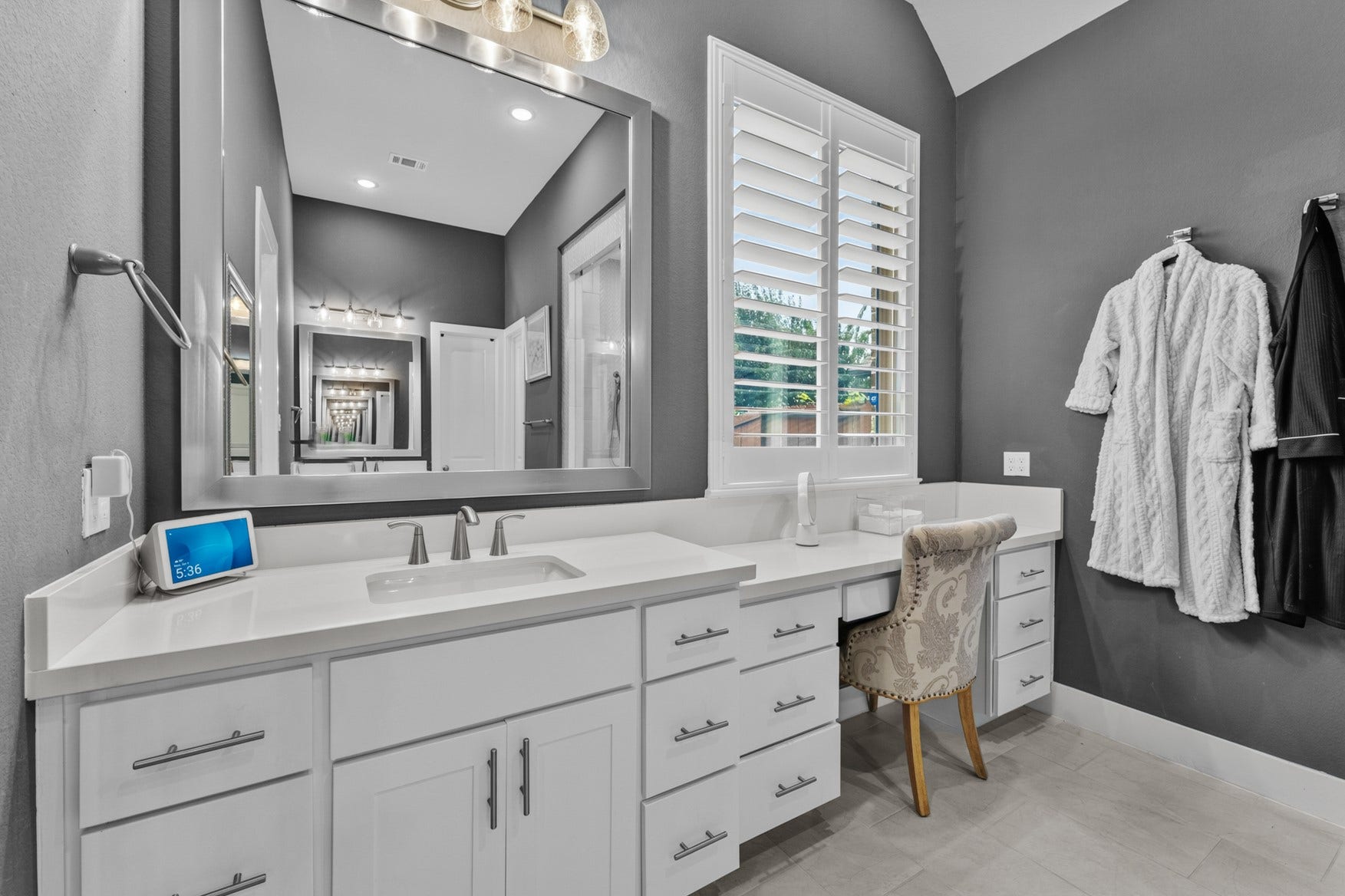 2214 Almond Creek Lane, Fulshear, TX 77423 This vanity area provides ample counter space and storage, and a built-in vanity desk. A second sink/vanity is on the opposite side of the bathroom.