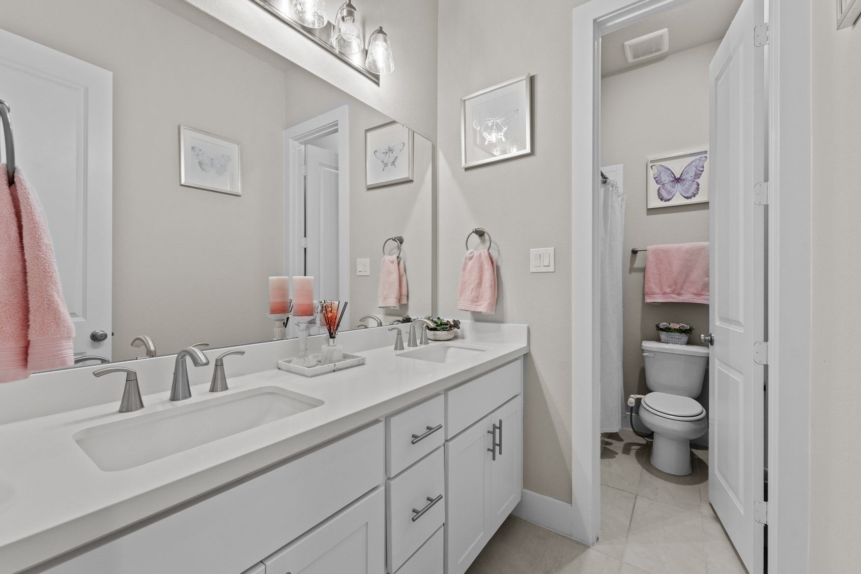 2214 Almond Creek Lane, Fulshear, TX 77423 The shared bathroom with two sinks and a door that separates the tub/shower combo makes morning prep easy!