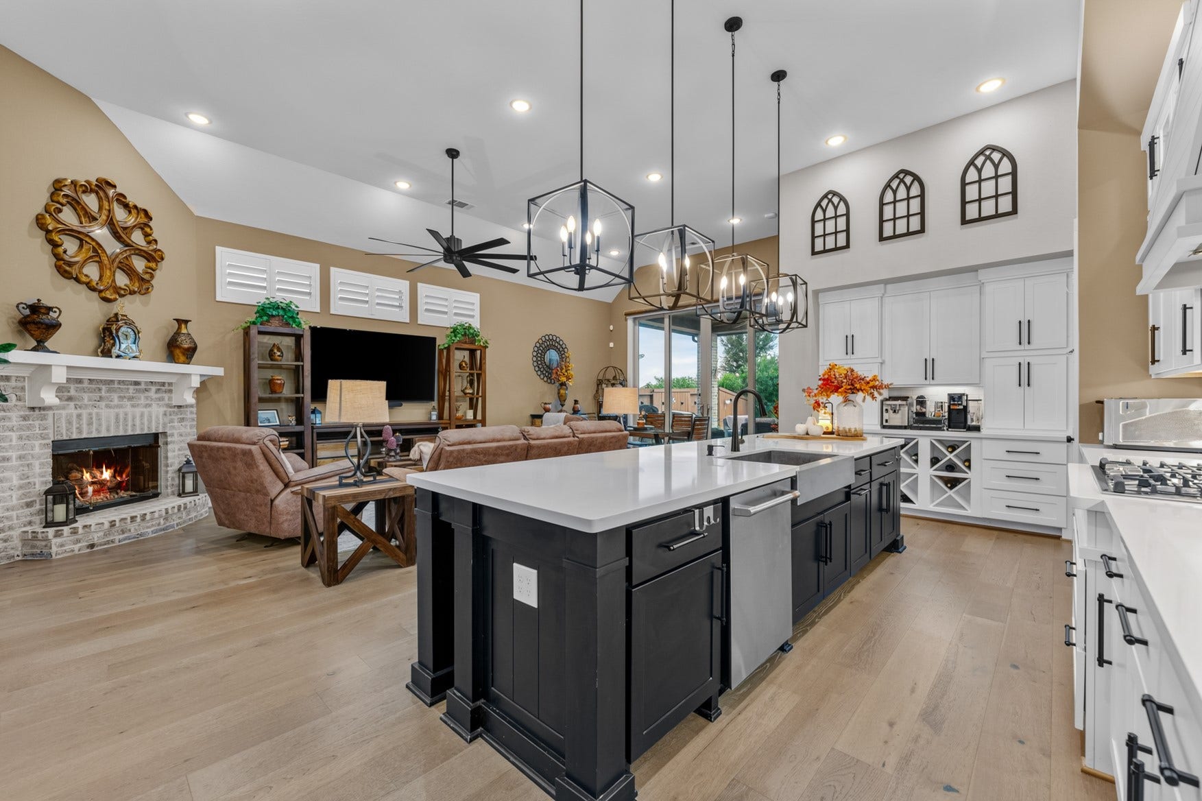 2214 Almond Creek Lane, Fulshear, TX 77423 Open-concept living at its best! Spacious kitchen and living areas with high ceiings and warm wood floors create a welcoming space for everyone to enjoy!