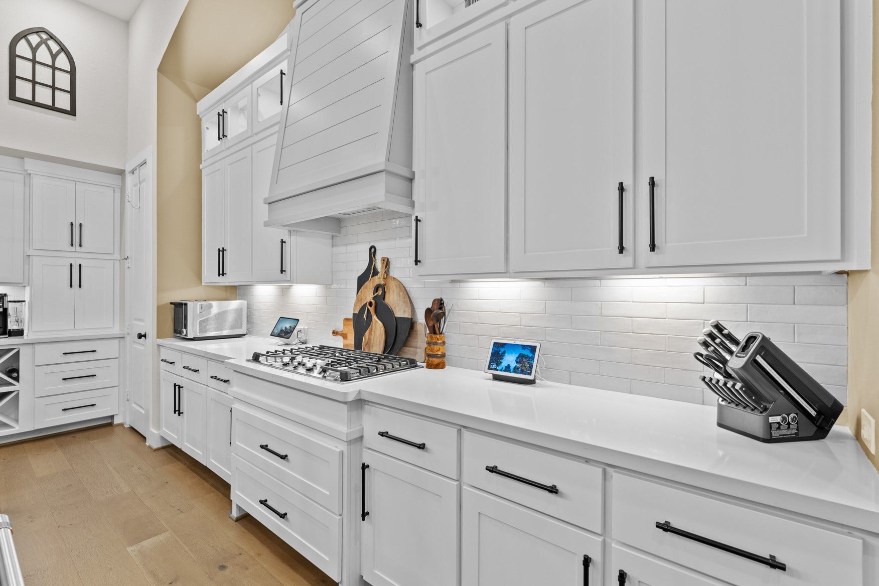 2214 Almond Creek Lane, Fulshear, TX 77423 Abundant storage options wrap around three sides of this kitchen - pots and pans drawers, two pantries, coffee nook, wine rack, and more!