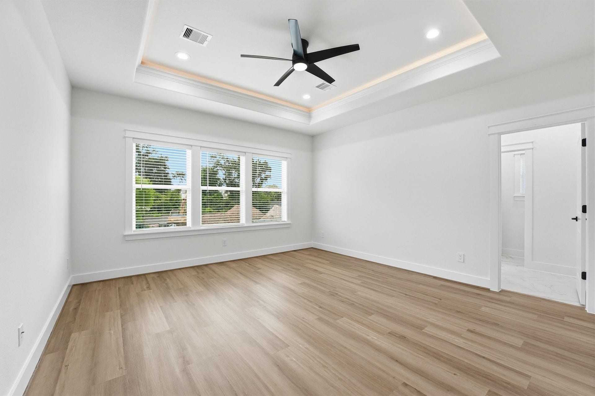 Upgrade the Primary Bedroom with an Elegant Tray Ceiling Featuring Built- In LED Accent Lighting