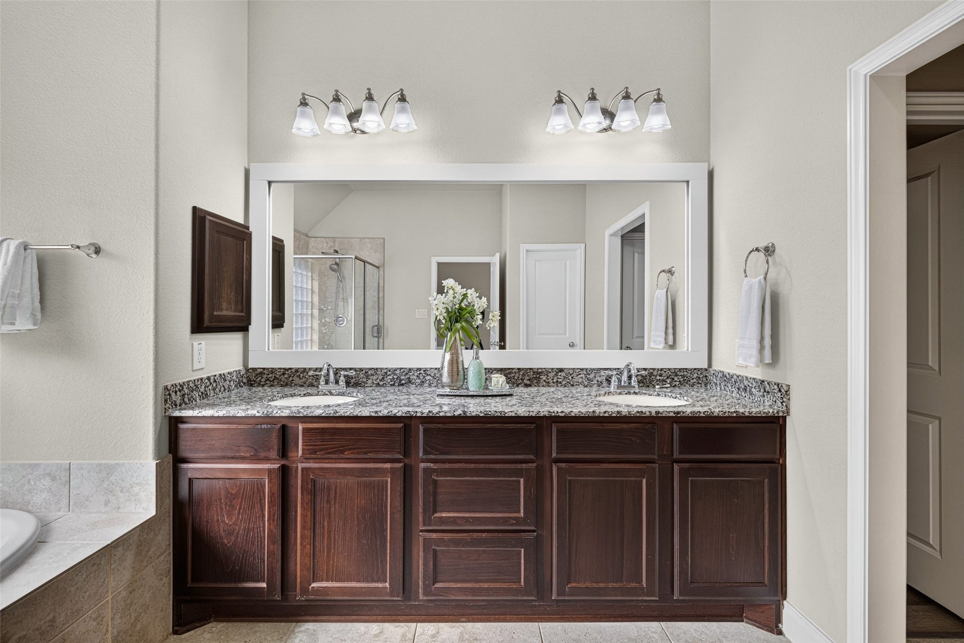 Ensuite primary bath featuring dual vanities, giving everyone their own space to get ready in the morning.