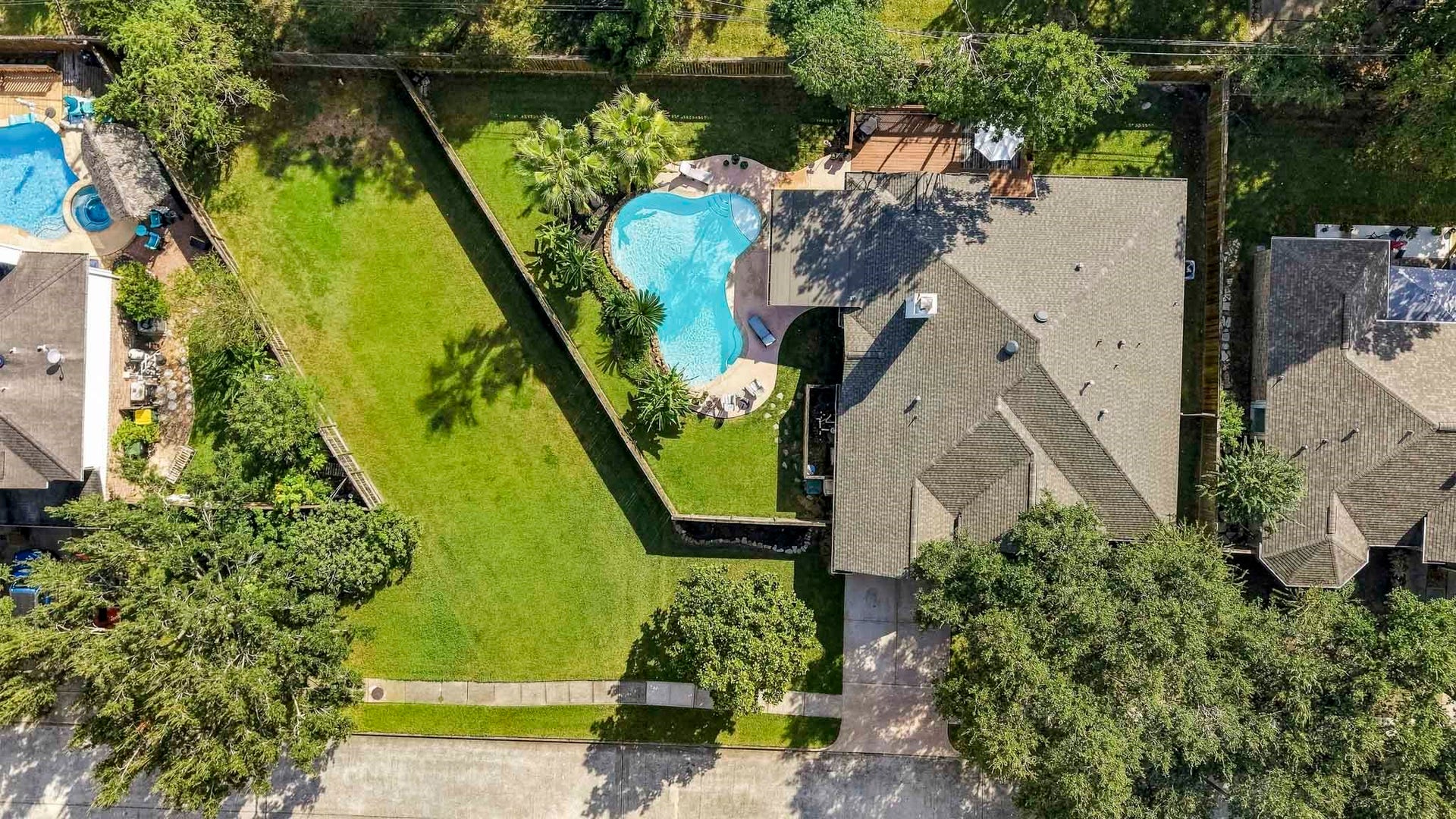 3905 Kimberly Drive, Pearland, TX 77581 Large backyard with pool and covered patio, plus greenspace to the side!