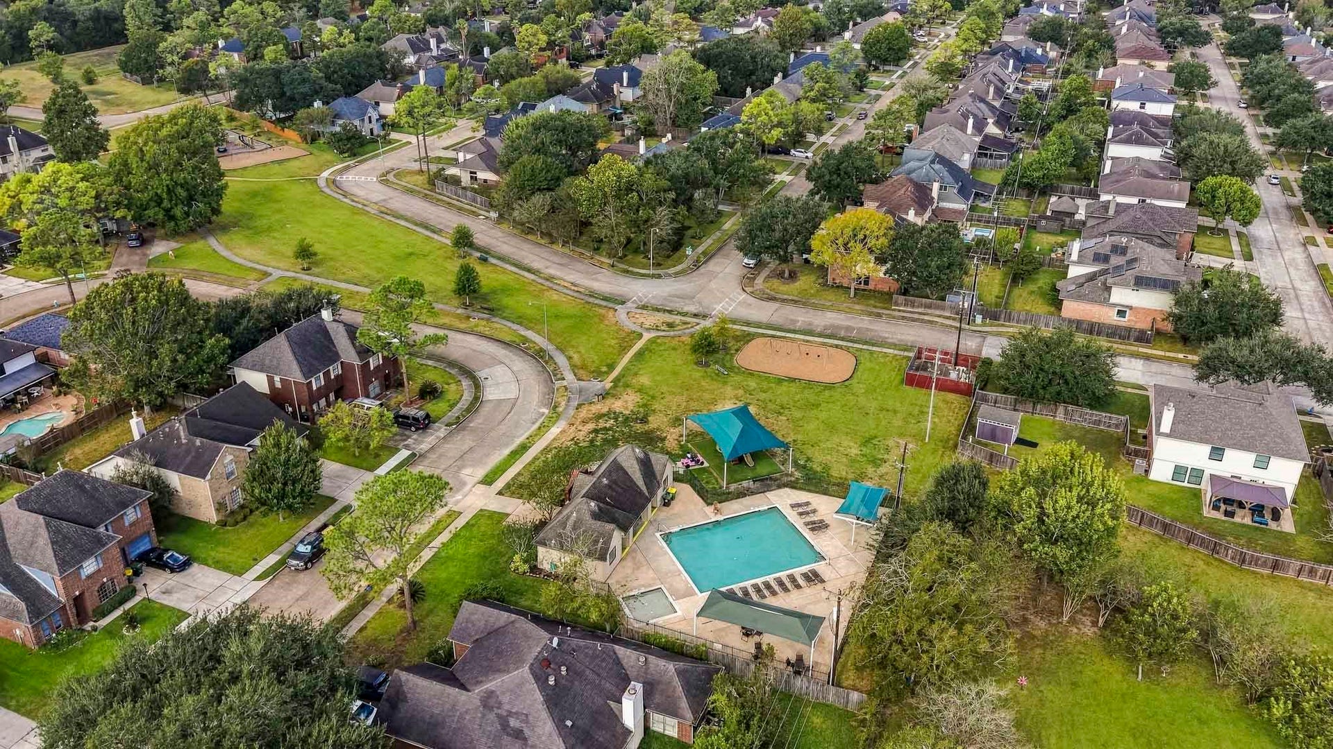 3905 Kimberly Drive, Pearland, TX 77581 Pool, covered playground and swings easily walkable from the house!