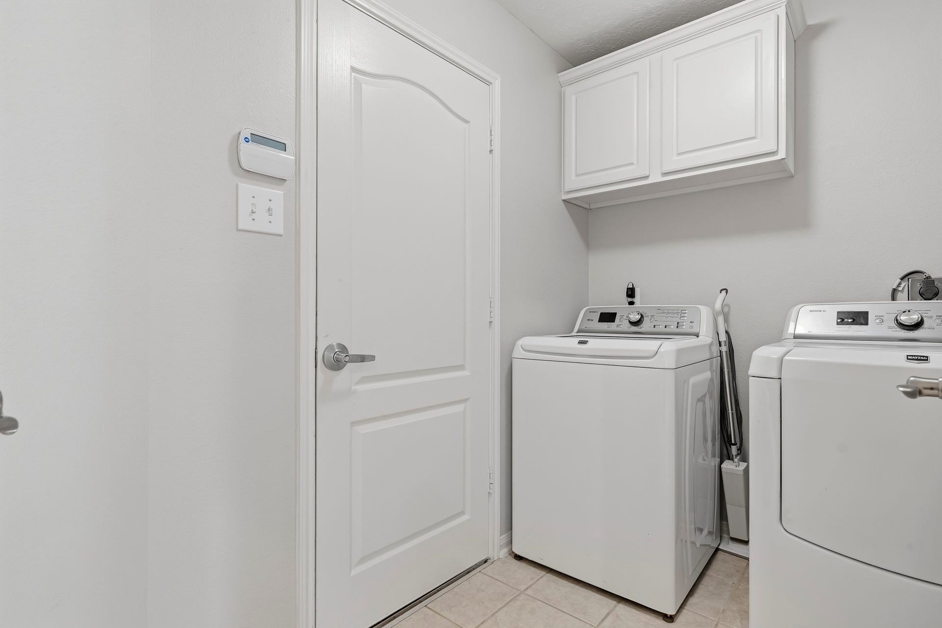 3905 Kimberly Drive, Pearland, TX 77581 Interior laundry room between dining and attached garage