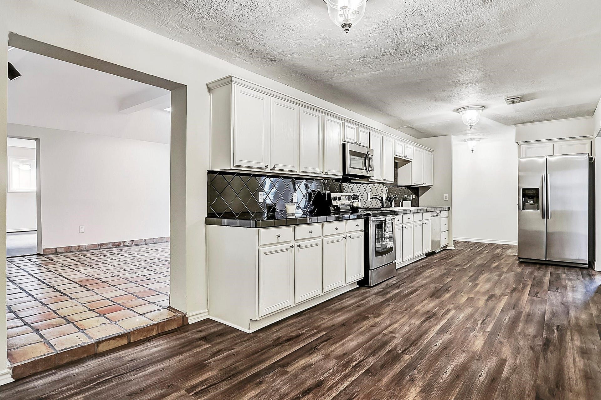 9402 Bevlyn Drive, Houston, TX 77025 Kitchen: Stainless appliances, fridge included, good storage.
