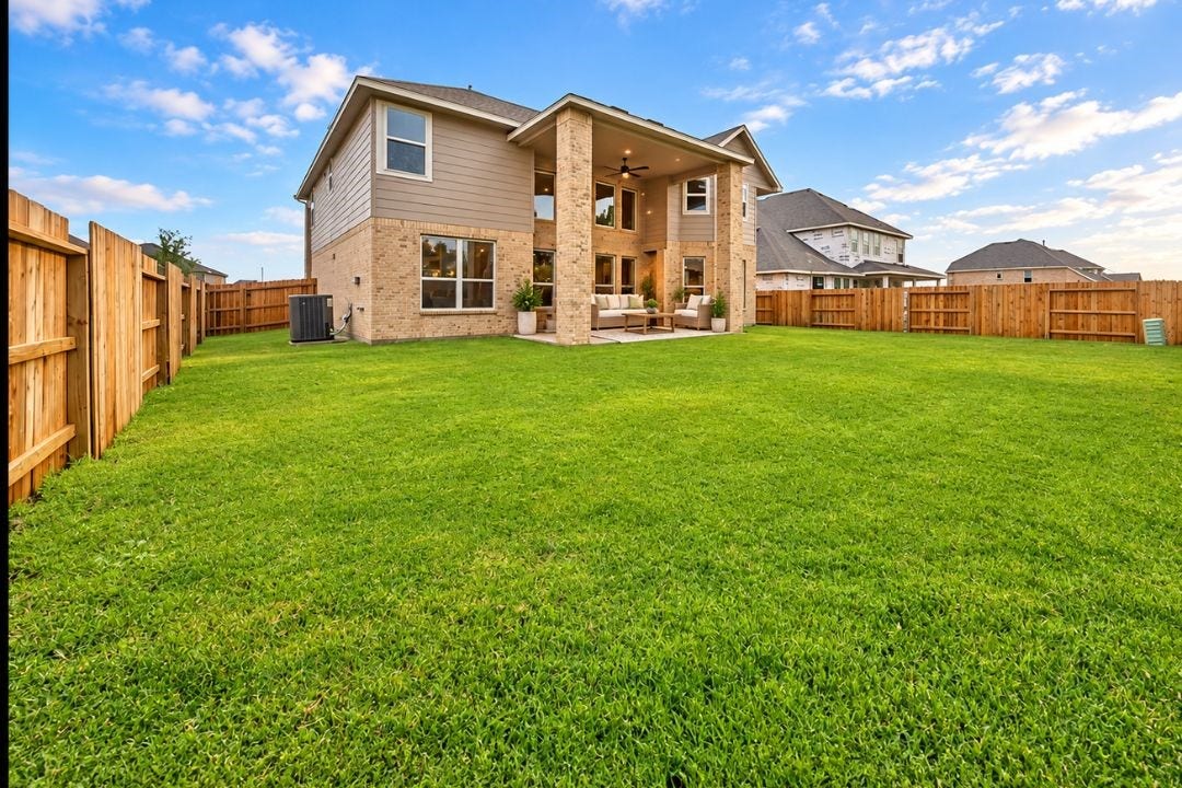 4510 Shaded Arbor Way, Sugar Land, TX 77479 Large fenced backyard offering an expansive lawn and plenty of outdoor space. This image has been virtually staged for illustrative purposes.