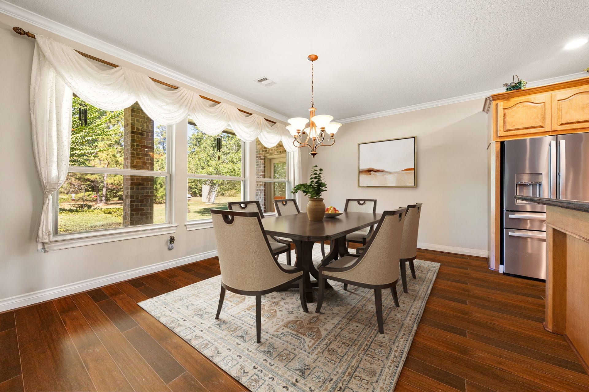 13506 Stagecoach Road, Magnolia, TX 77355 This elegant breakfast area is surrounded by large picture windows that fill the space with natural light and offer serene views of the backyard. Perfectly positioned off the kitchen, it provides an inviting setting for morning coffee or casual dining with family and friends.