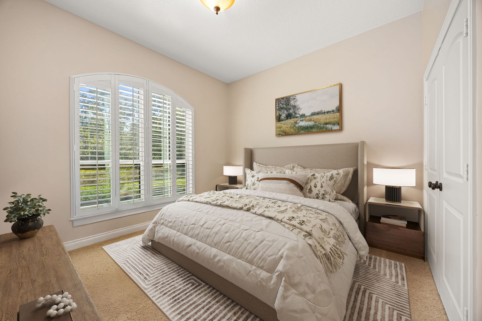 13506 Stagecoach Road, Magnolia, TX 77355 This inviting secondary bedroom features soft natural light, plantation shutters, and neutral tonescreating a peaceful retreat ideal for guests or family.