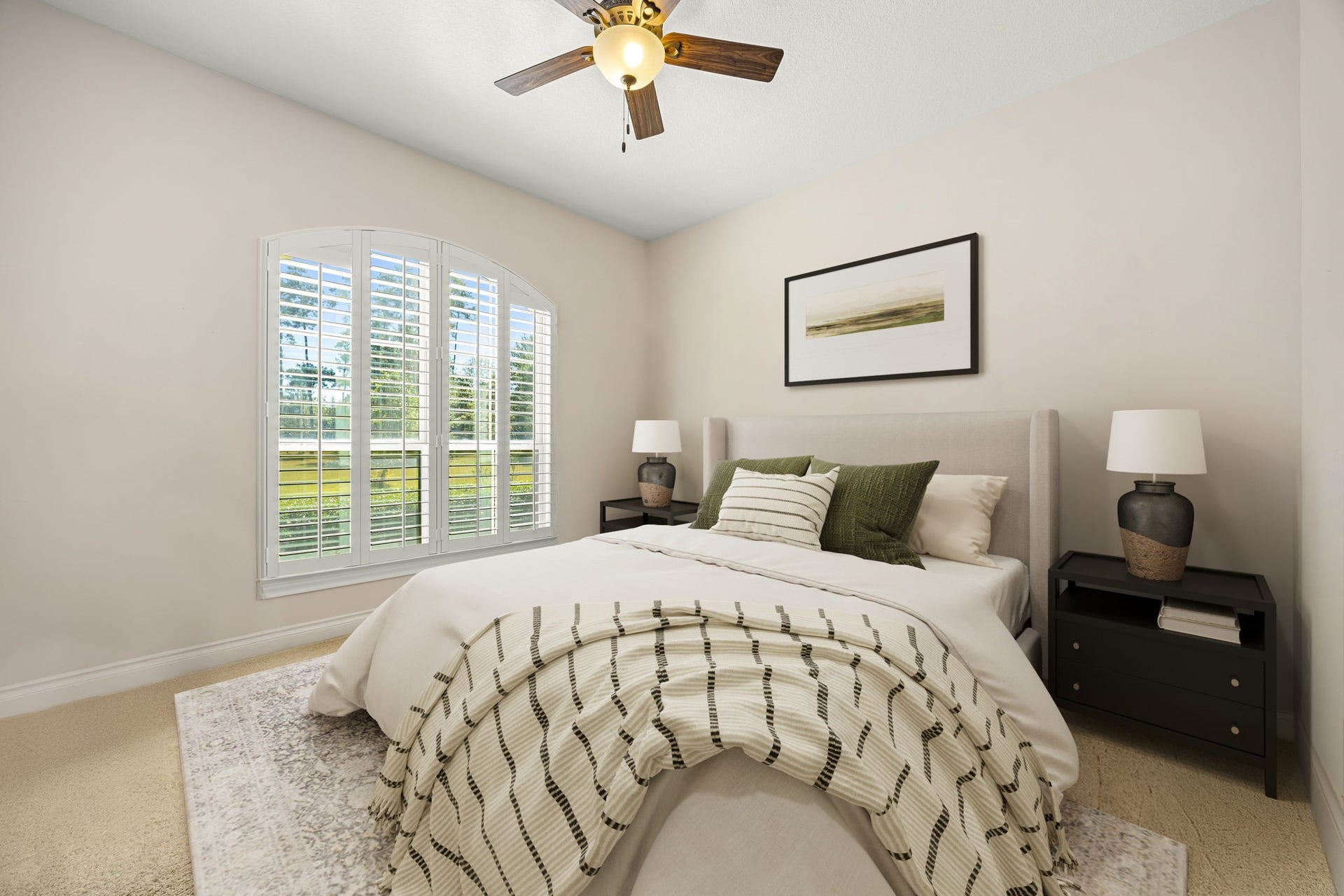 13506 Stagecoach Road, Magnolia, TX 77355 A bright and comfortable secondary bedroom featuring large windows with plantation shutters, soft neutral tones, and plenty of natural light, perfect for guests or family.