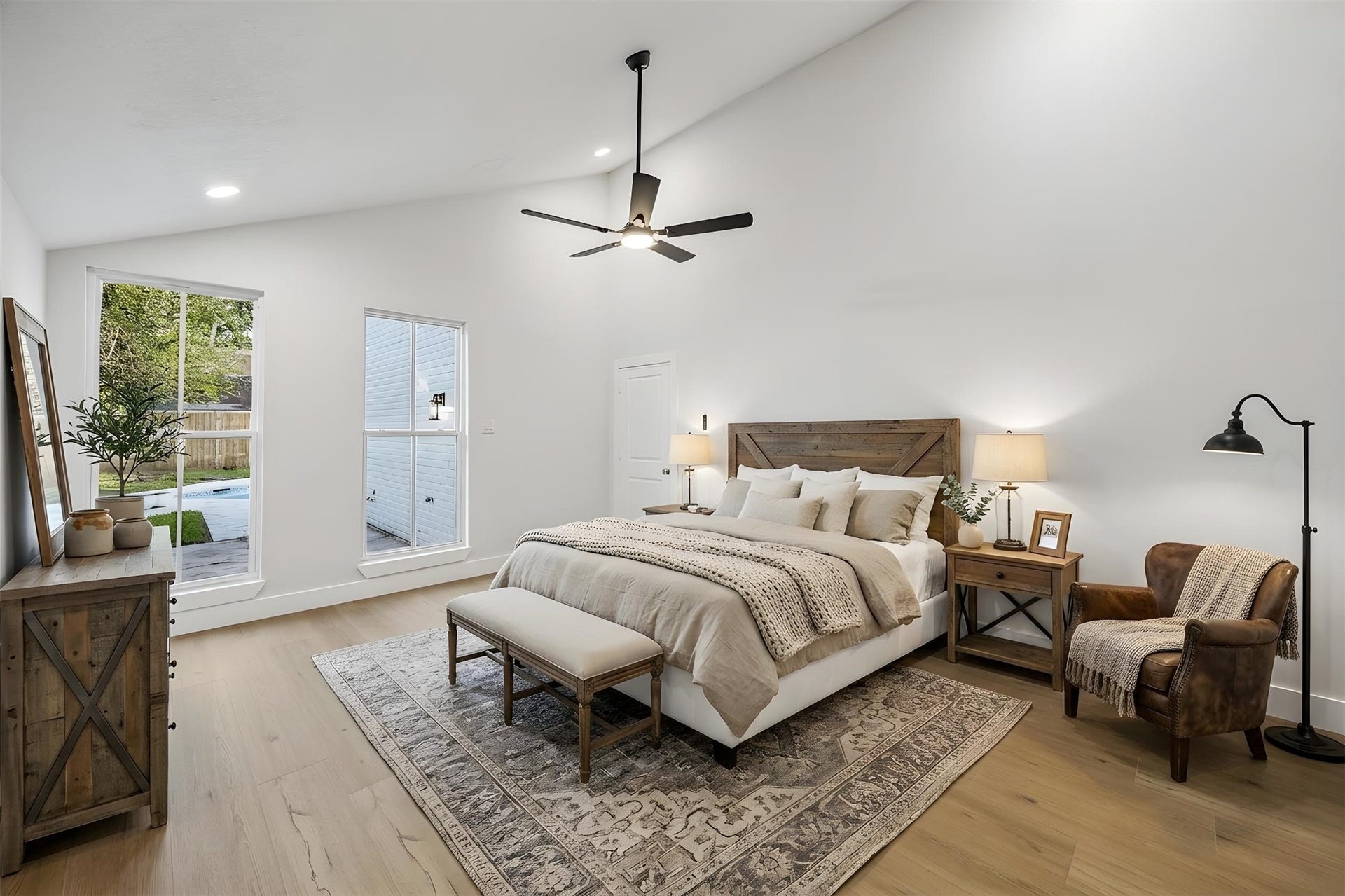 11947 Fawnview Drive, Houston, TX 77070 13x16 first floor primary bedroom. no carpet here. tall windows that overlook backyard. high ceilings.