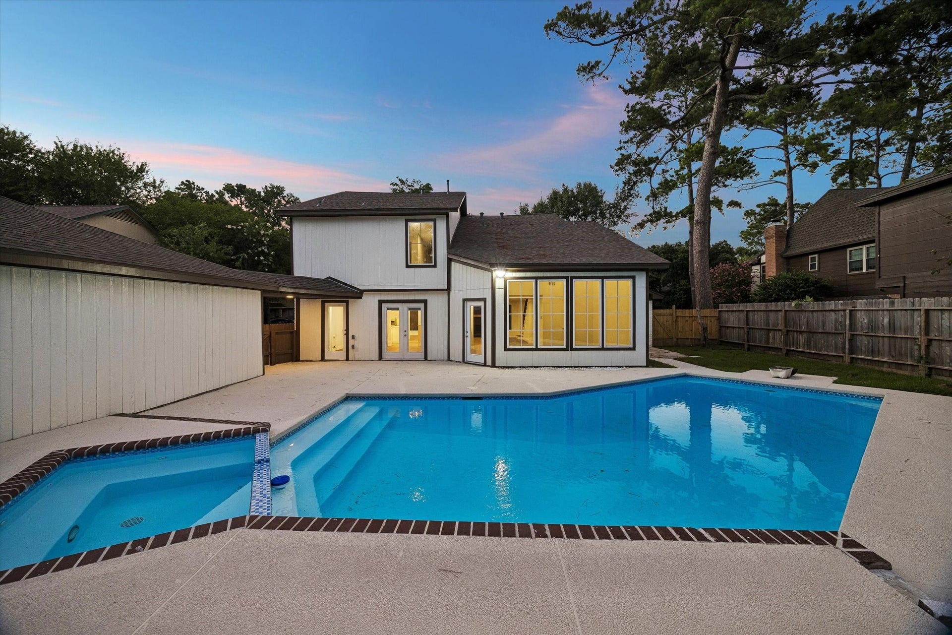 11947 Fawnview Drive, Houston, TX 77070 Refurbished pool and deck area featuring a resurfaced pool, updated decking, and exterior lighting perfect for Houston summers. Professionally refreshed and move-in ready.