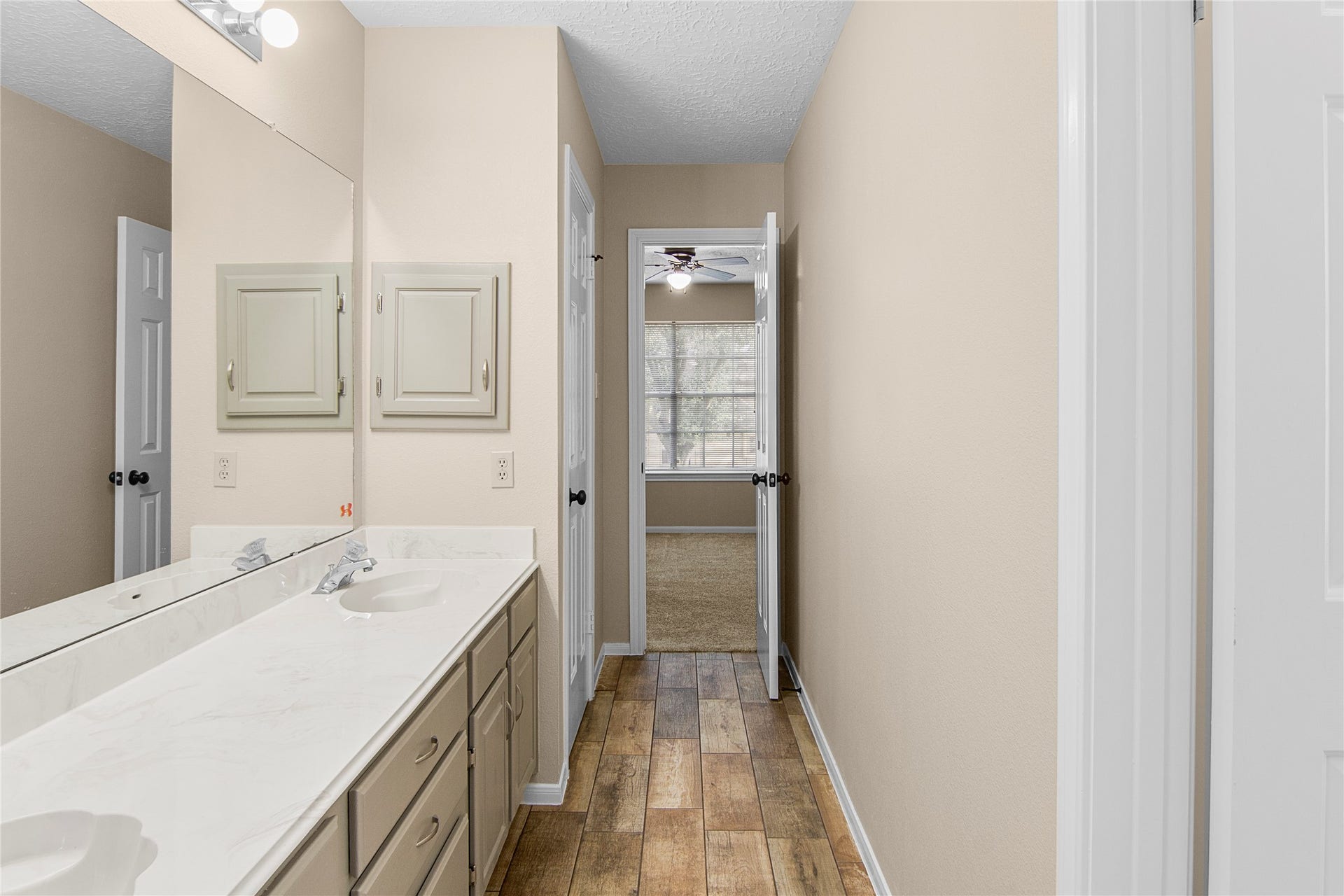 12503 Oakcroft Drive, Houston, TX 77070 shared bathroom looking into bedroom 1