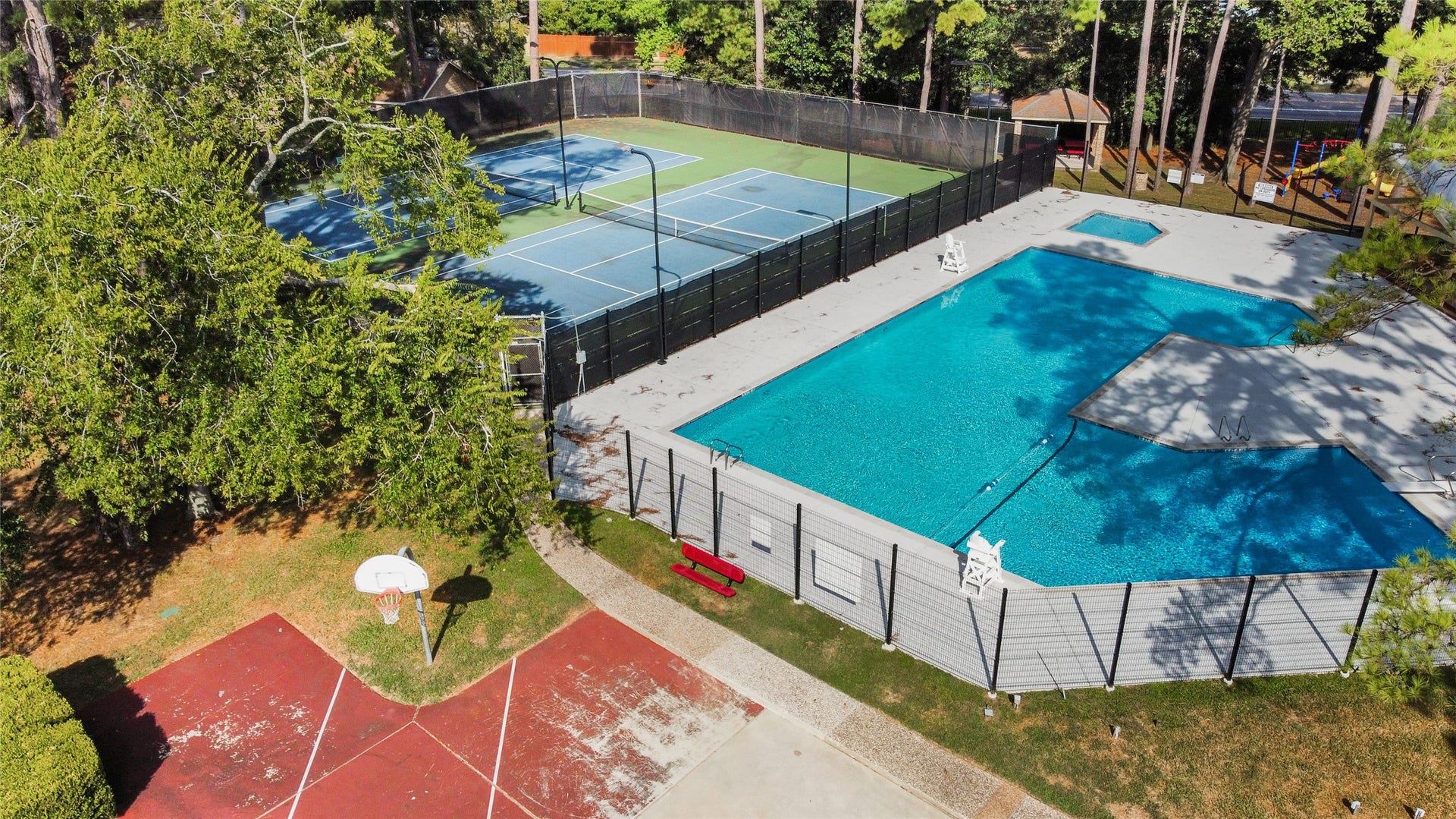12503 Oakcroft Drive, Houston, TX 77070 community picnic area, basketball hoop, pool, tennis court, and playground