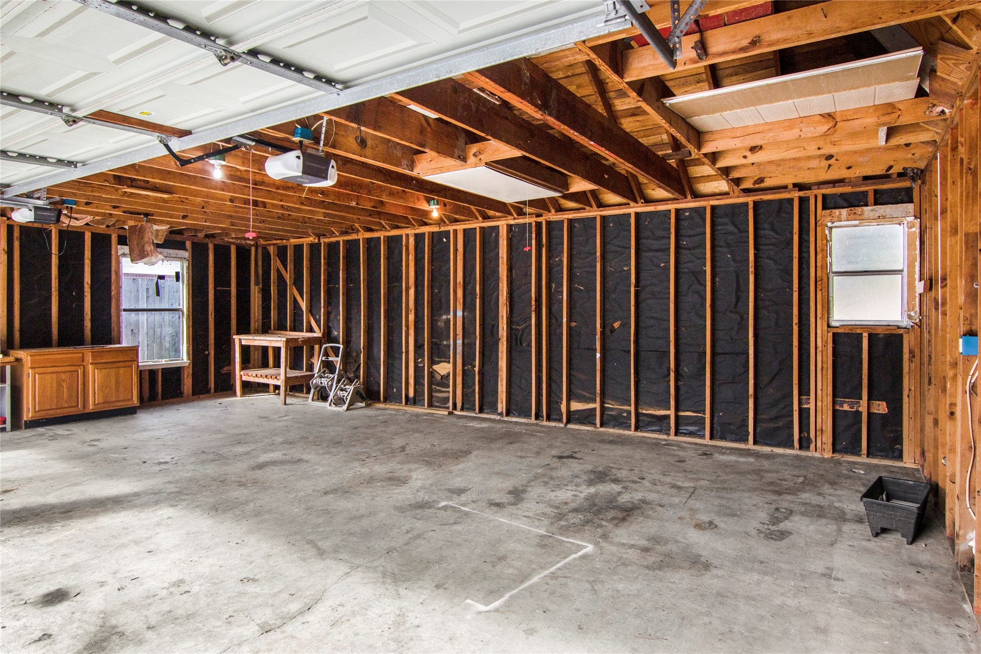 12503 Oakcroft Drive, Houston, TX 77070 three car garage with roughed in plumbing for half bath