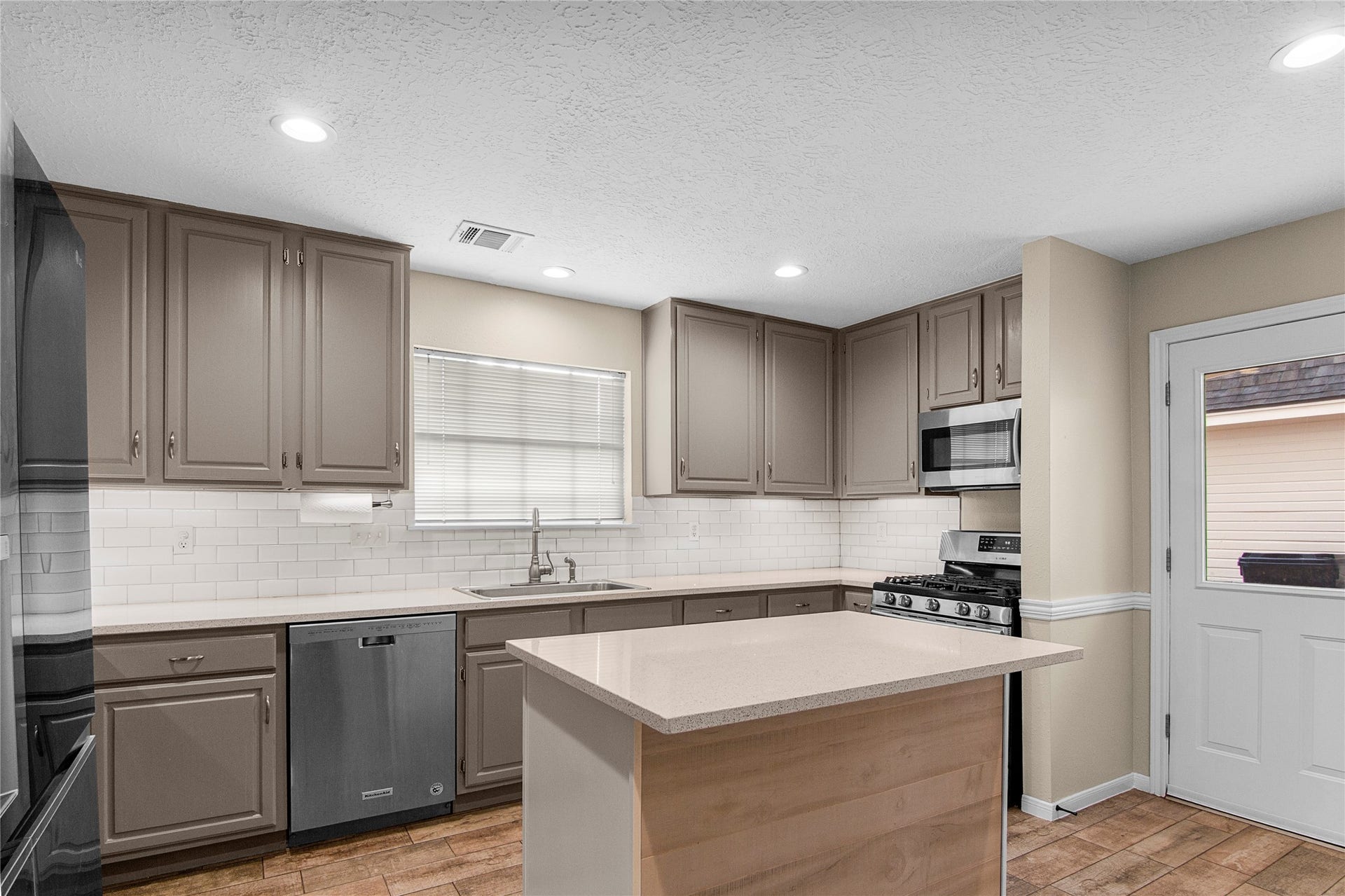 12503 Oakcroft Drive, Houston, TX 77070 An updated kitchen meets you at the backdoor