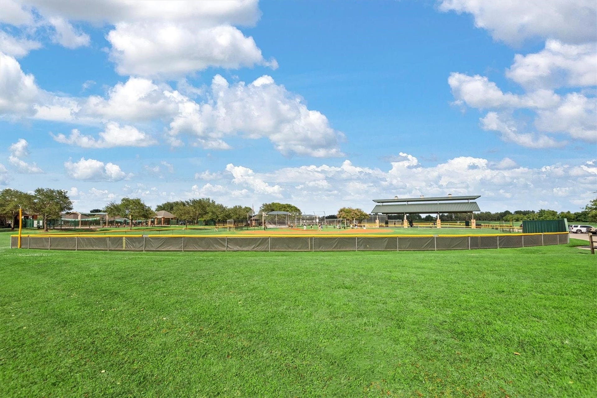 43 Highclere Park Drive, Spring, TX 77379 Athletic Center w/baseball fields, volleyball, soccer, pickleball courts, playground and competition pool