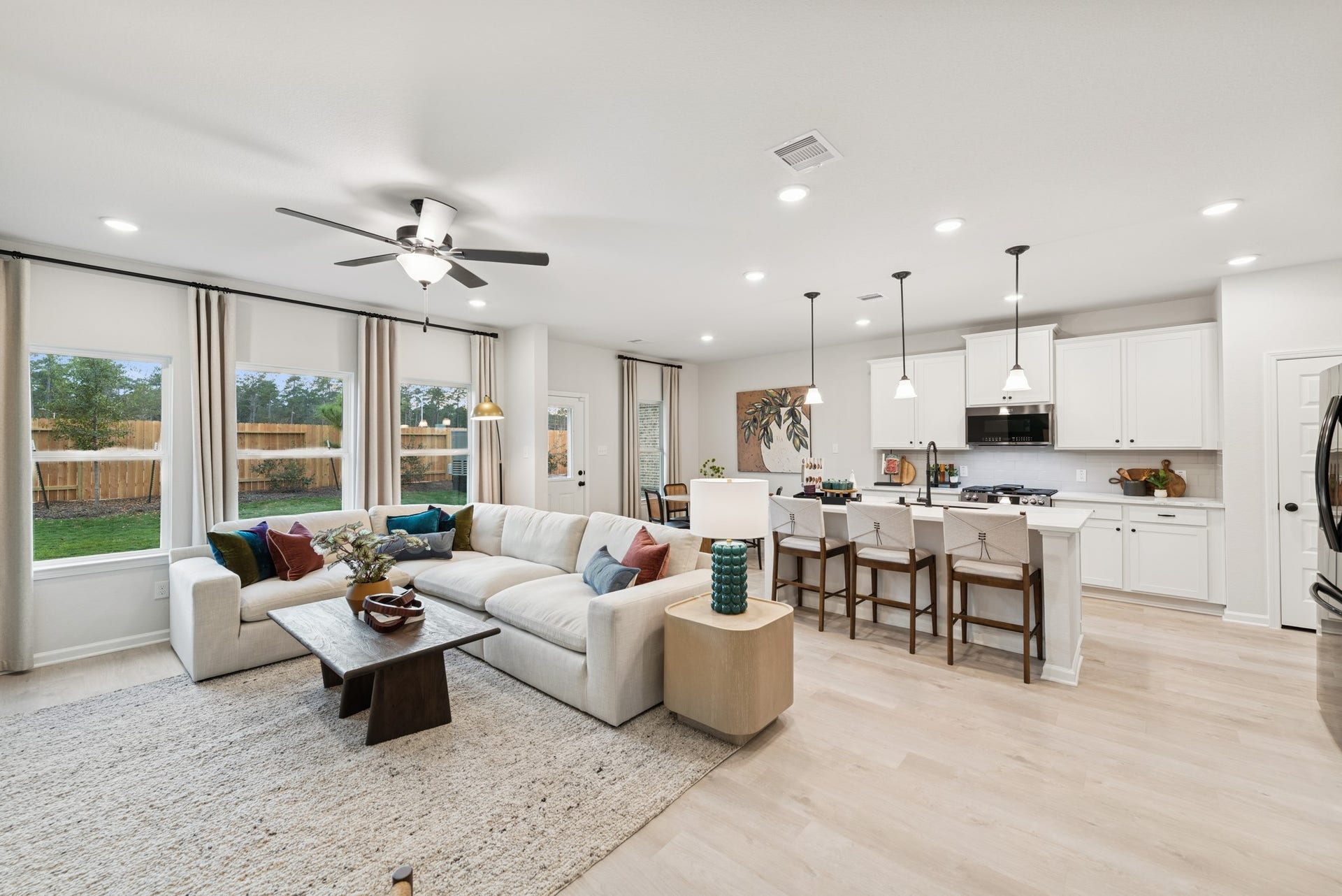 8914 Adana Drive, Montgomery, TX 77316 The Princeton II- Family Room and Kitchen. Staged model home shown for illustration only; actual features, colors, and upgrades may vary.
