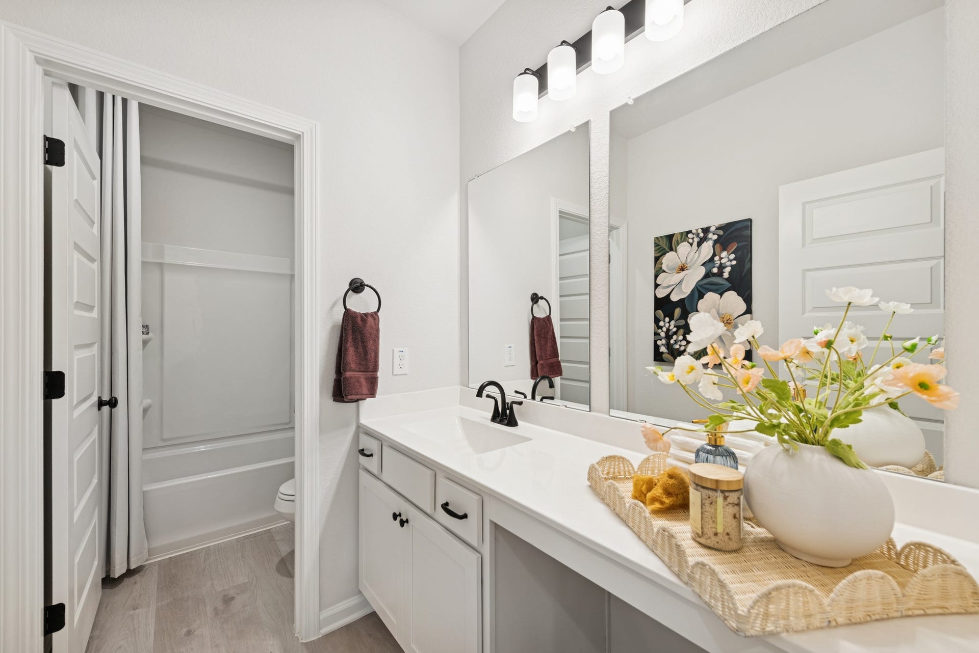 8914 Adana Drive, Montgomery, TX 77316 The Princeton II- Hall Bath with Dual Vanities. Staged model home shown for illustration only; actual features, colors, and upgrades may vary.