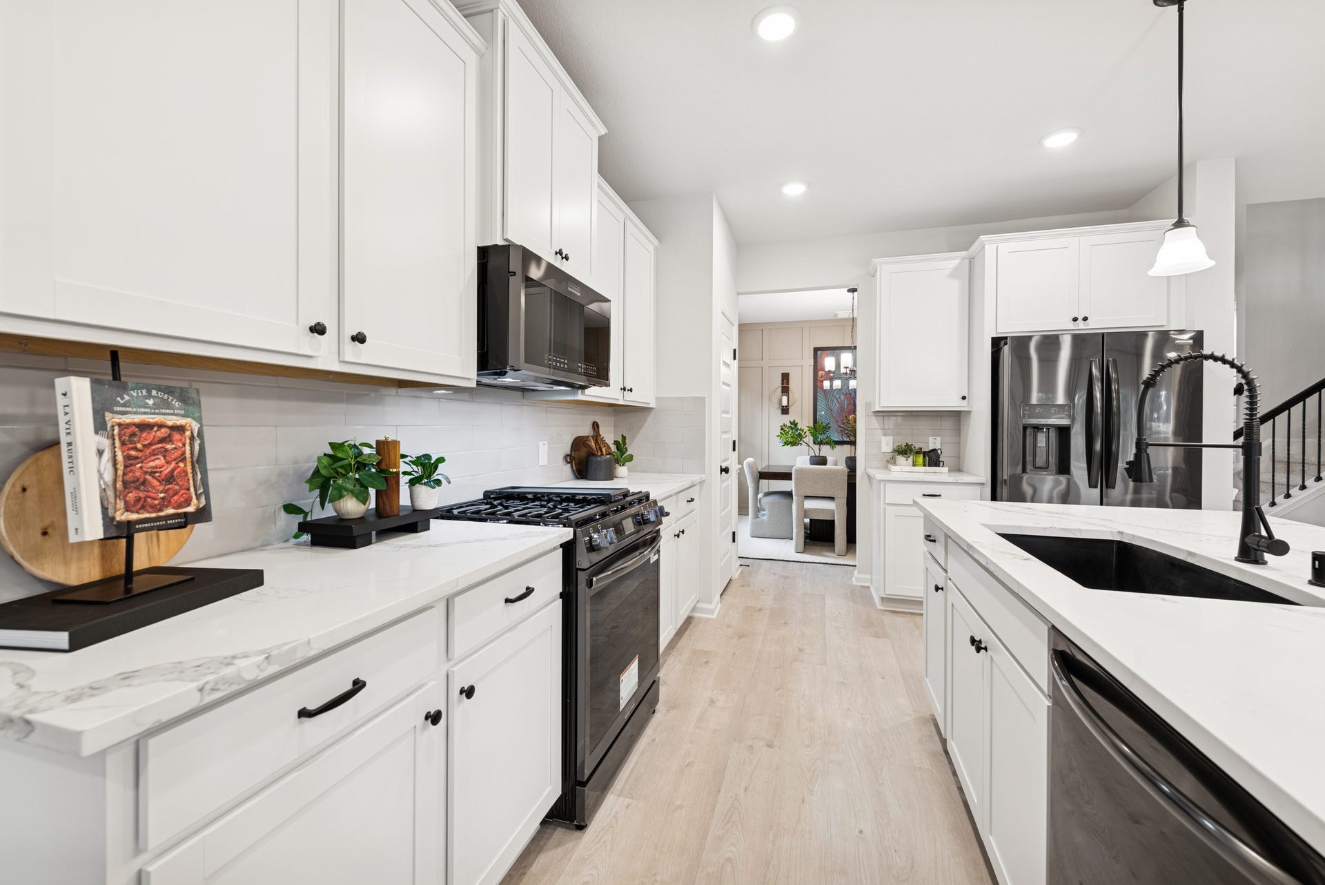 8914 Adana Drive, Montgomery, TX 77316 The Princeton II- Kitchen. Staged model home shown for illustration only; actual features, colors, and upgrades may vary.