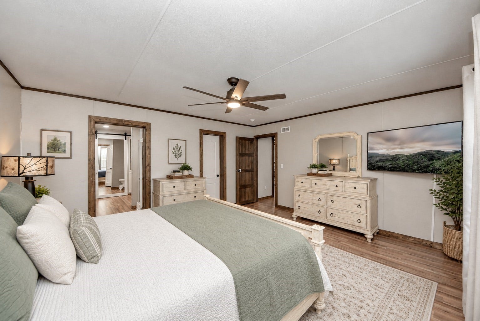 12565 Royal Green Drive, Conroe, TX 77303 Virtually staged primary bedroom with ensuite bathroom.