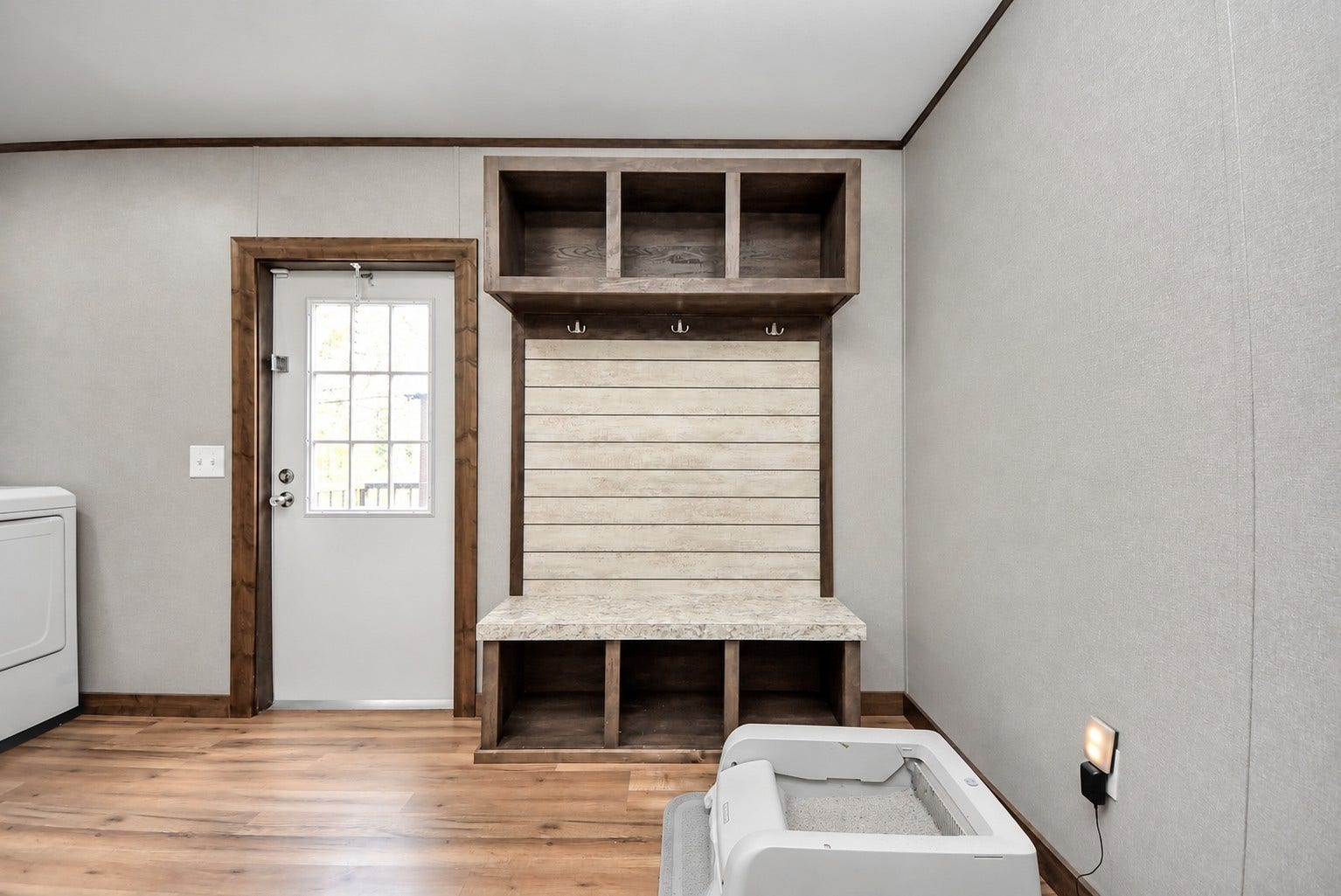 12565 Royal Green Drive, Conroe, TX 77303 Laundry and mudroom area featuring built-in storage cubbies and direct outdoor access.