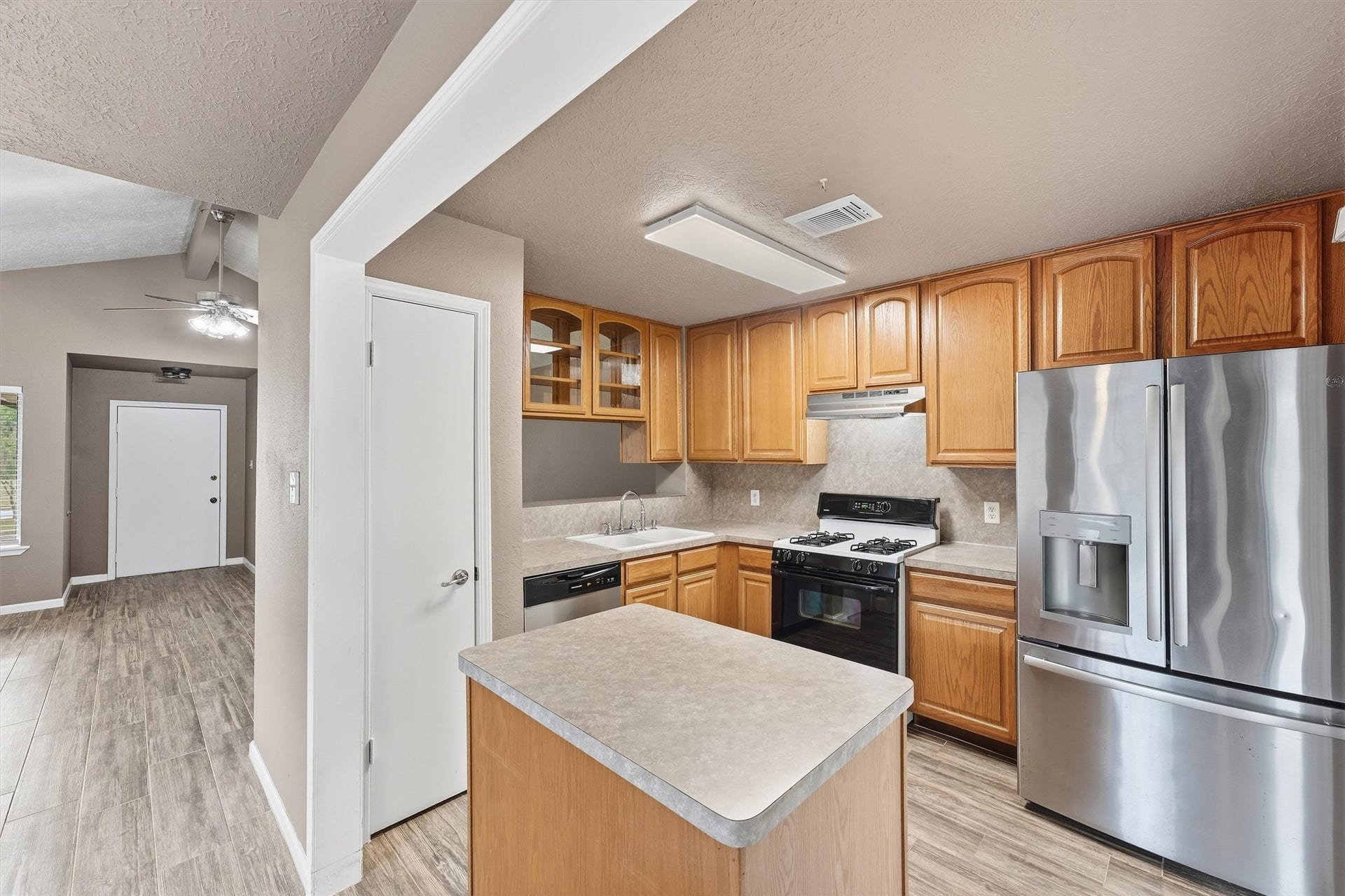 New dishwasher and refrigerator in kitchen