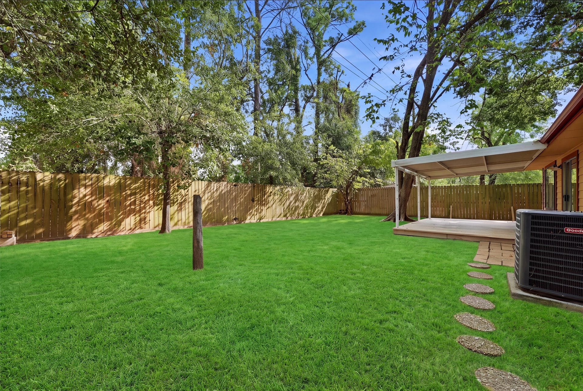 Spacious backyard with new fence
