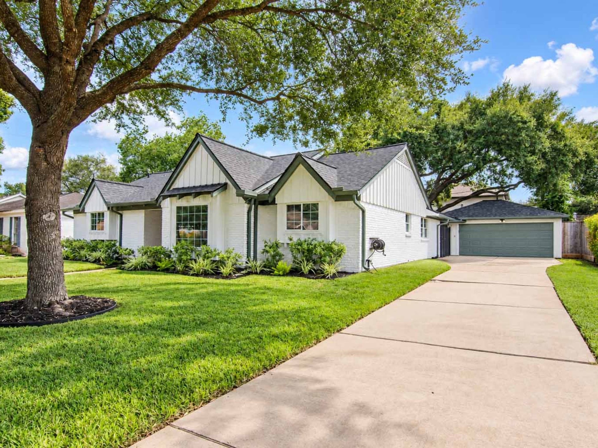 5611 Cheena Drive, Houston, TX 77096 Extended driveway with a two car garage.