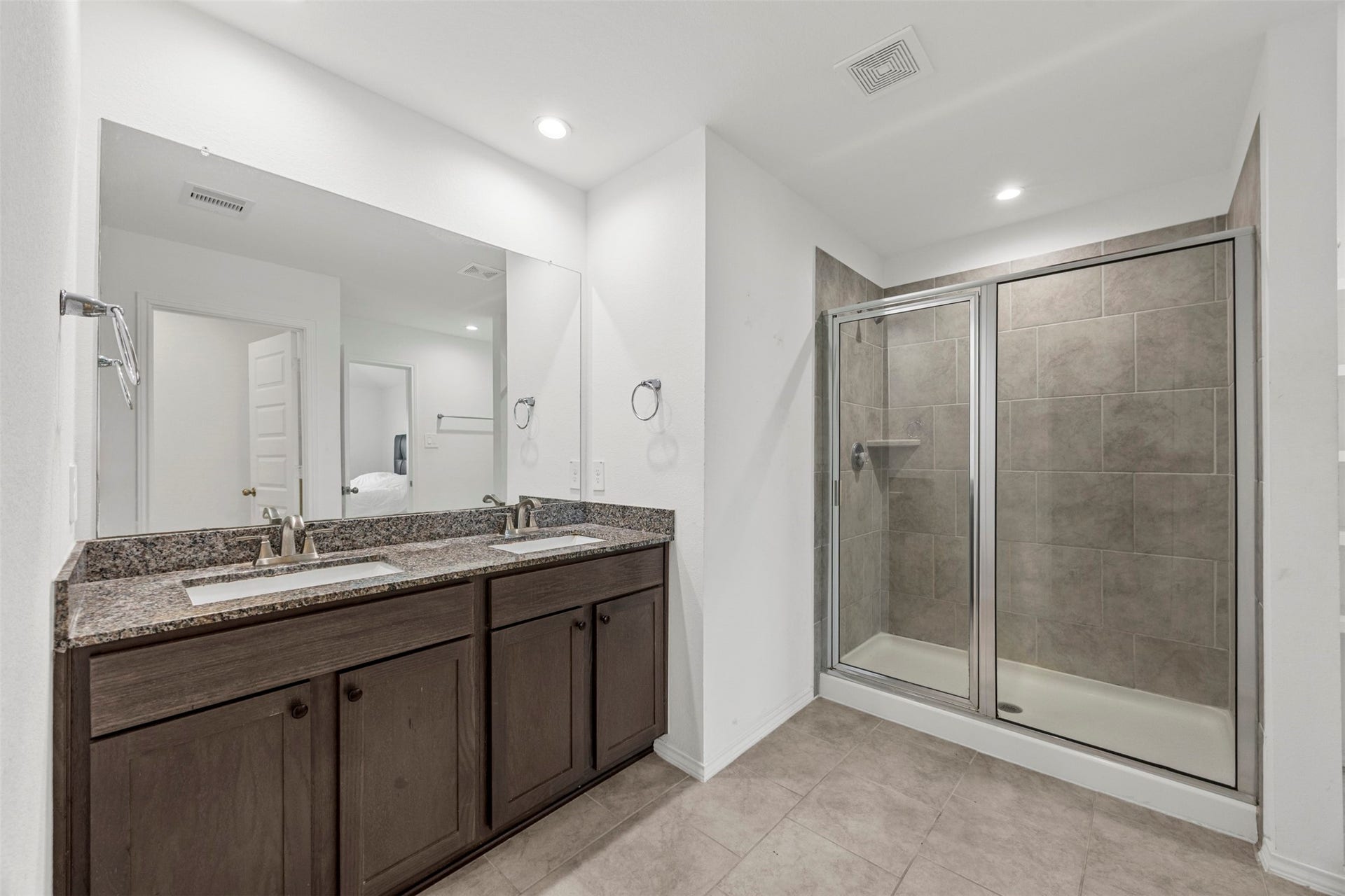 7511 Carson Court, Rosharon, TX 77583 The primary bathroom features a spacious dual-sink vanity, separate shower, and thoughtful everyday functionality.