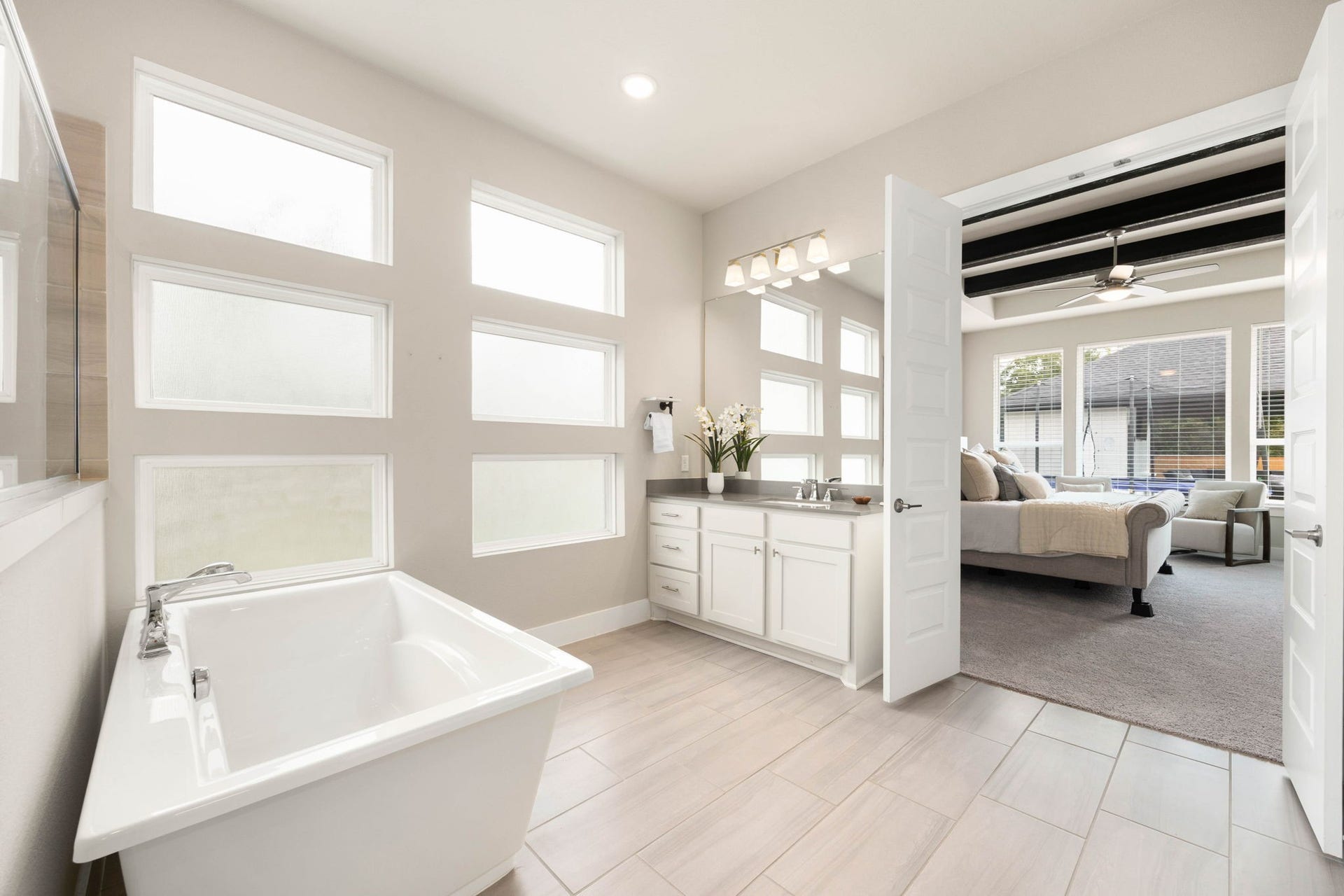 29559 Fulshear Lake Trace, Fulshear, TX 77406 Bright, spa-like primary bath with a freestanding soaking tub and abundant natural light.