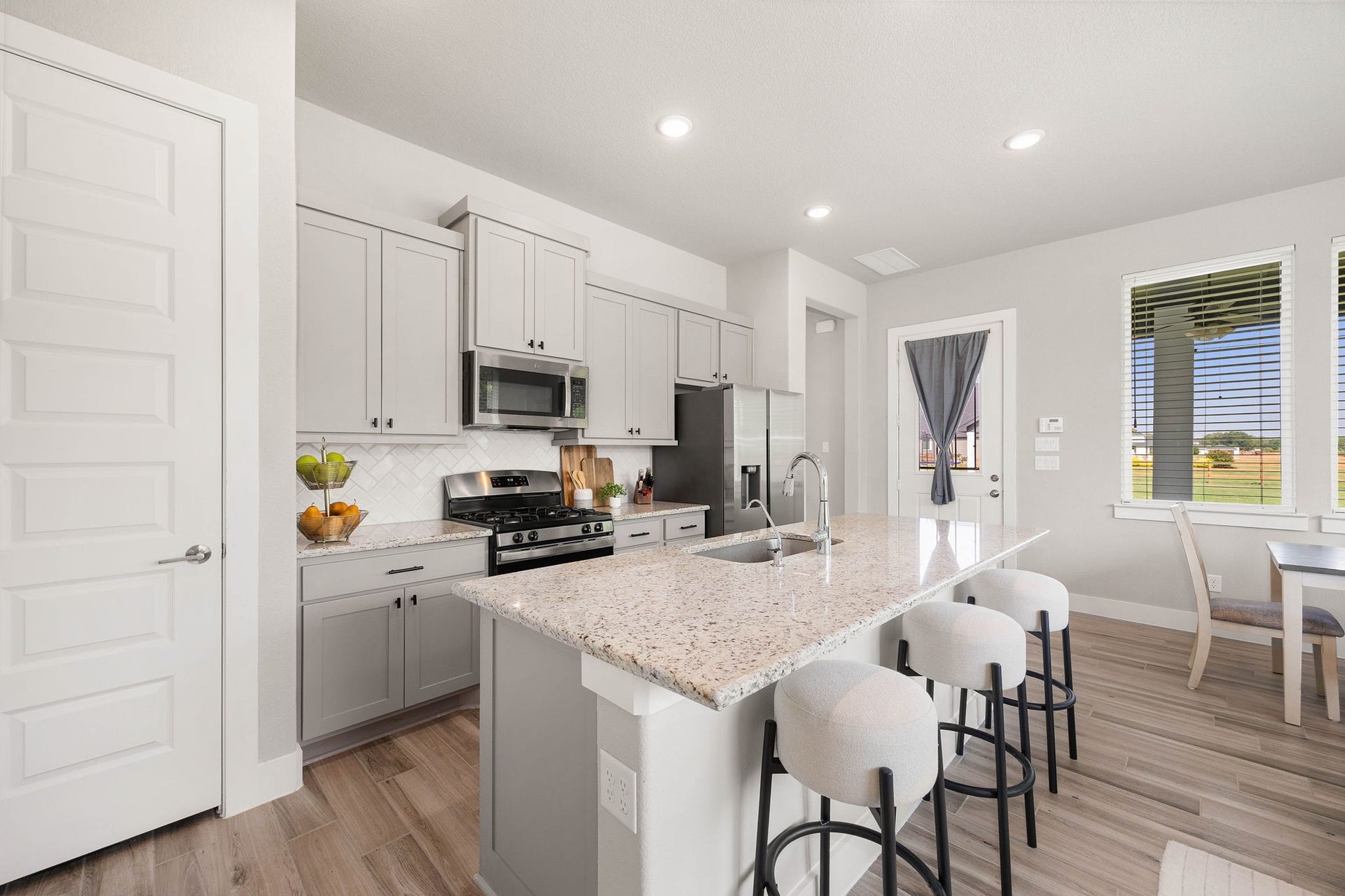 29559 Fulshear Lake Trace, Fulshear, TX 77406 The Casita's functional kitchen layout is complete with ample cabinetry, counter space and stainless appliances.