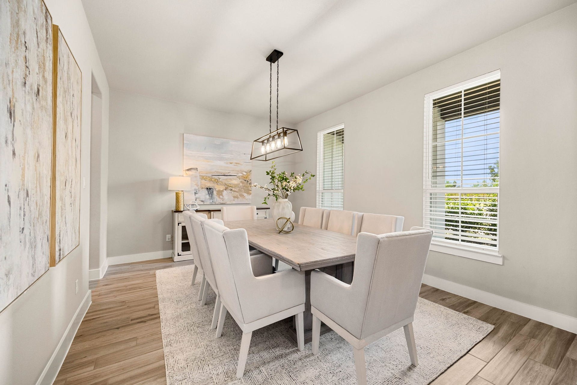 29559 Fulshear Lake Trace, Fulshear, TX 77406 Spacious formal dining room with a modern statement light fixture and an easy flow to the kitchen and living areas.
