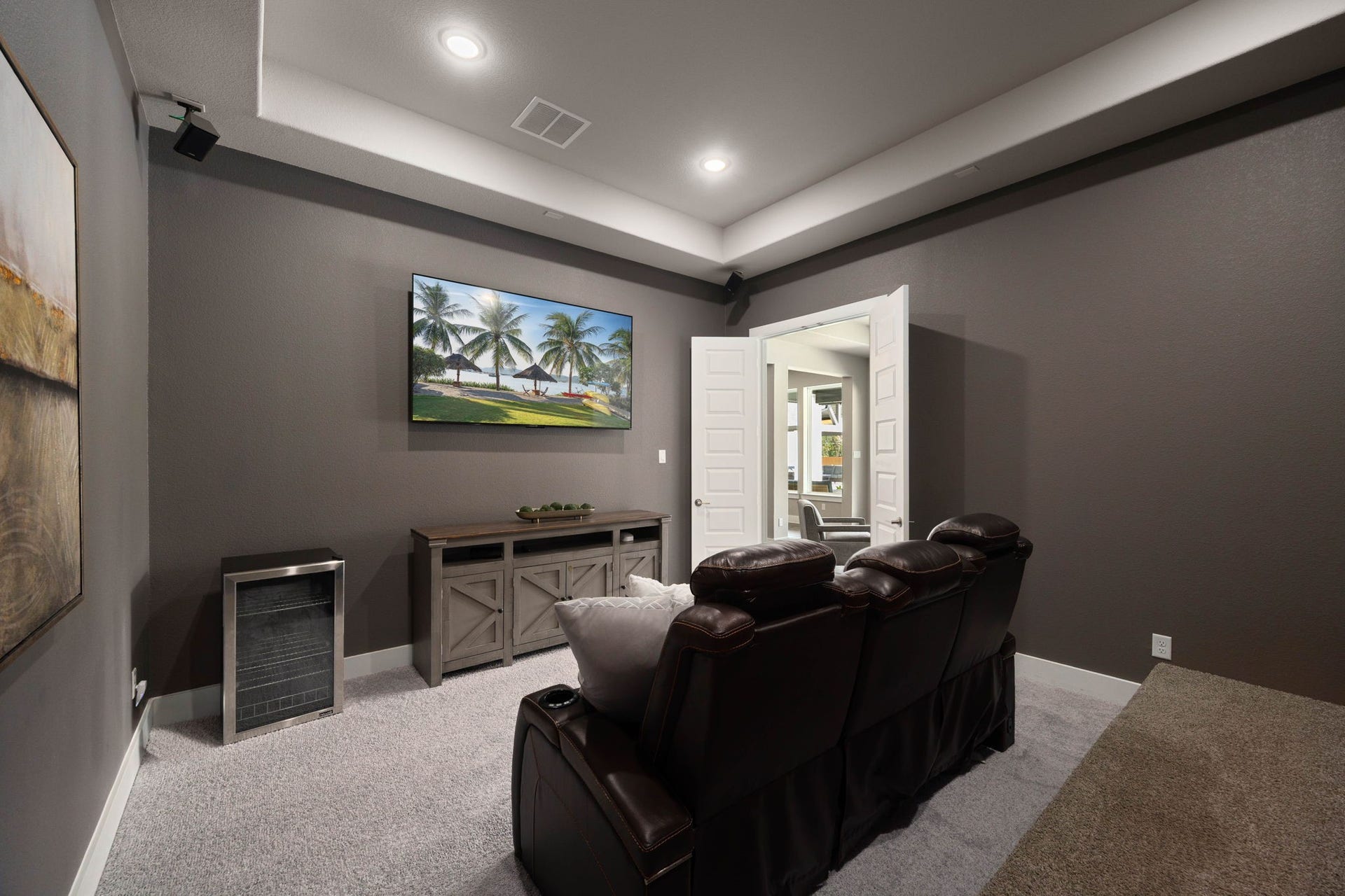 29559 Fulshear Lake Trace, Fulshear, TX 77406 Dedicated media room with tiered seating, creating the perfect setup for movie nights and game days.