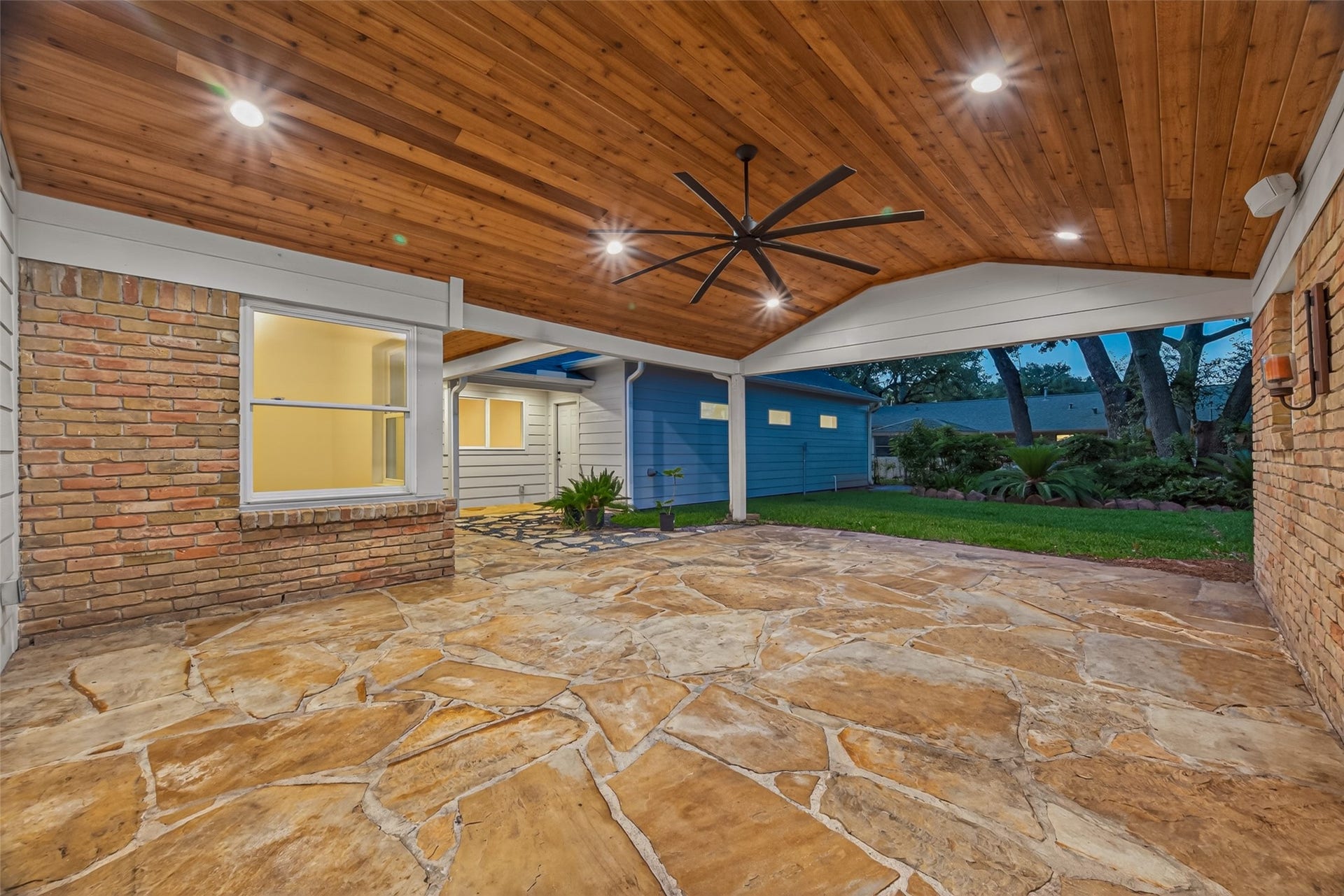 5638 Sanford Road, Houston, TX 77096 Your backyard retreat awaits. Vaulted cedar plank ceilings, flagstone flooring, and peaceful backyard views create an exceptional outdoor living space designed for relaxing, entertaining, and making lasting memories.