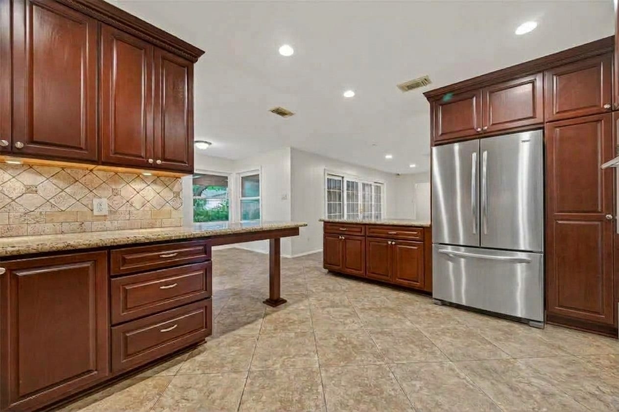5638 Sanford Road, Houston, TX 77096 Kitchen opens to the breakfast nook and family room, creating an ideal layout for everyday living and entertaining. Refrigerator not included in sale of home.